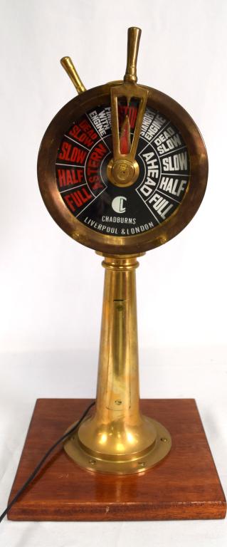 CHADBURNS ENGLISH BRASS VIKING BINNACLE LIGHT: Signed Chadburns, Liverpool & London. Double sided dial with red and white lettering on black ground. Measures 17 ½ inches tall. Mounted on 9 ½ inches square wood base. Good condition.