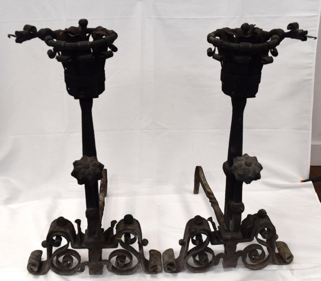 WROUGHT IRON JACOBEAN STYLE ANDIRONS:: Very ornate wrought iron. Measure 33 inches tall and approx. 43 pounds each. Scroll base. List of shippers whitesauctions.com. Good condition.