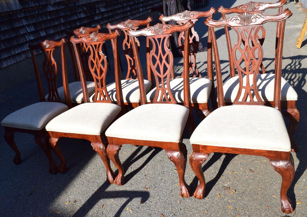 EIGHT CHIPPENDALE STYLE MAHOGANY DINNING CHAIRS: 20th century. White damask upholstery. Ball and claw foot. Good condition.