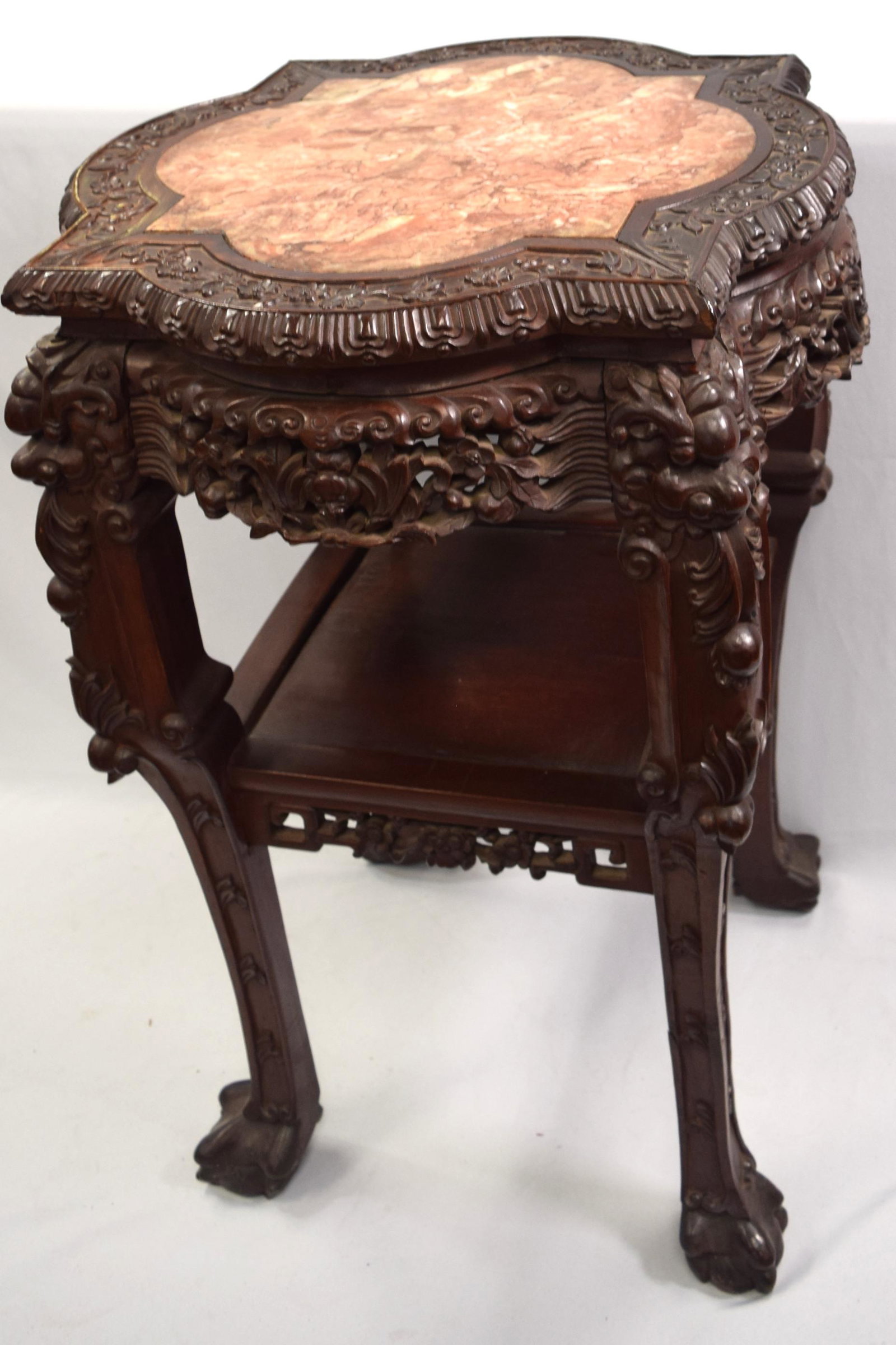 ORIENTAL MARBLE INSERT CARVED STAND: Chinese export with shape marble insert. carved rosewood stand with carved feet. Crack marble. 32 inches tall x 21 wide top. Glue repair one foot.