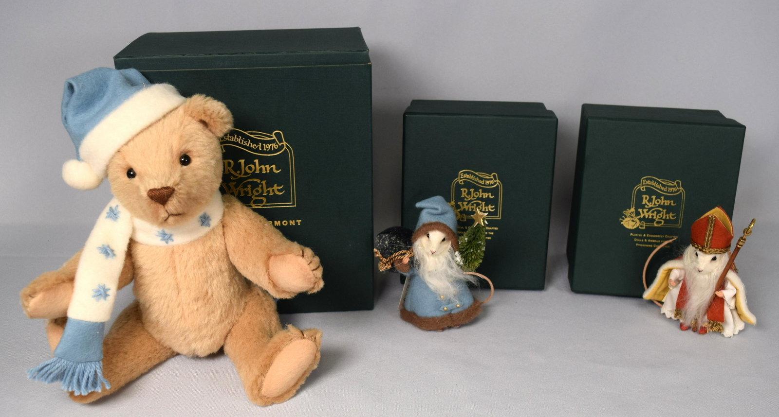 THREE R. JOHN WRIGHT CHRISTMAS BOXED ITEMS: Consisting of 1) Tucker #20 - a delightful Teddy made of fine custom-made mohair/wool plush in a warm butterscotch color with airbrushed shading. He is five-way jointed and measures 10 inches tall sta