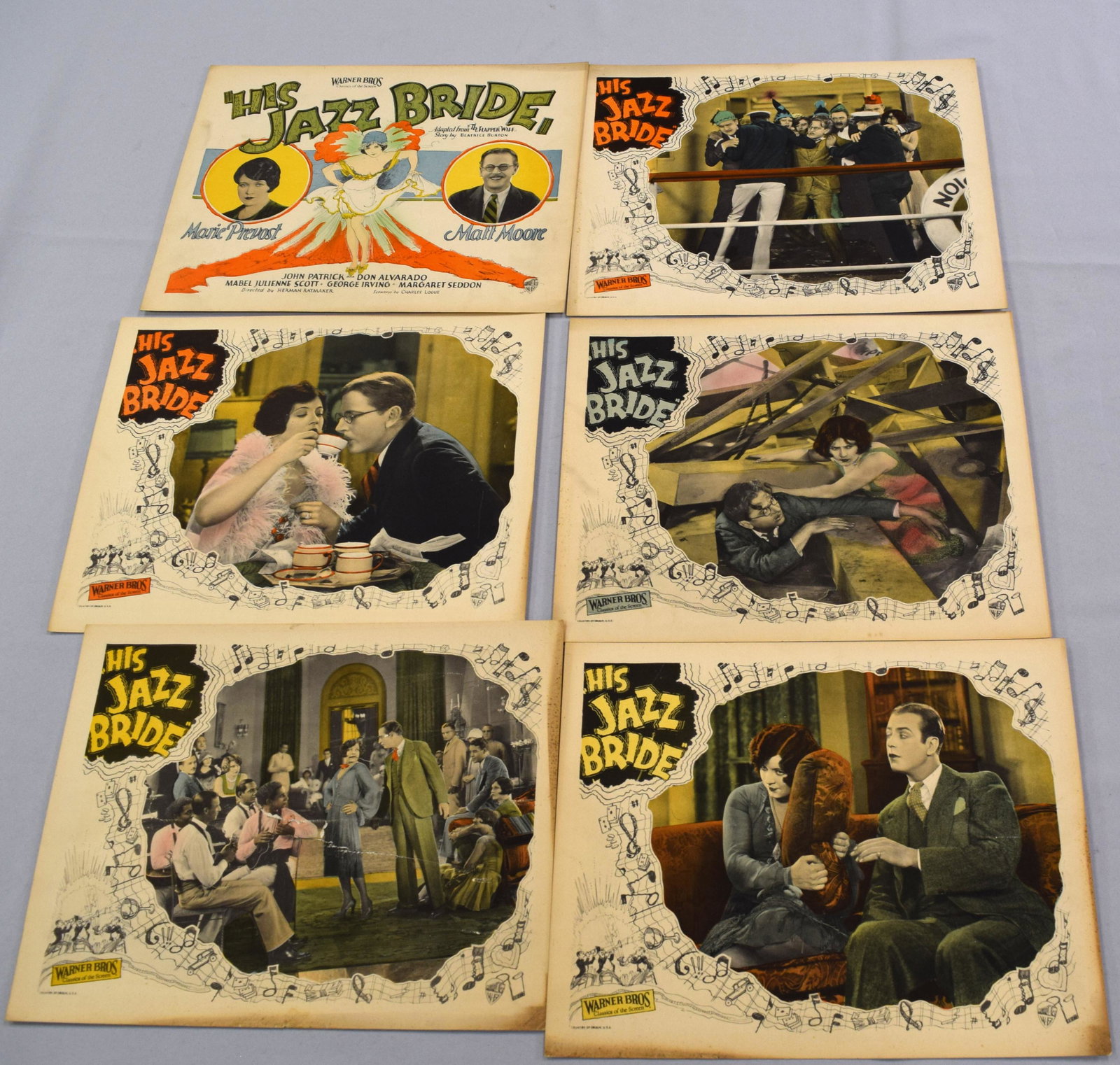 HIS JAZZ BRIDE MOVIE LOBBY CARDS: A set of (6) Cards in color. 11 inches x 14 inches. Printed on card stock. One with damage. His Jazz Bride is a 1926 American silent drama film released by Warner Brothers Pictures. Themovie starred M