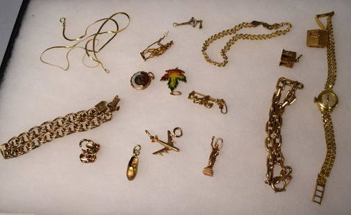 14K & 18K ASSEMBLED GOLD JEWELRY: 15 pieces. Consisting of two .750 gold pieces, a wrist watch by Tudor and swiss house charm. Approximately 12.10 DWT. 2) 13 miscellaneous pieces, charms and charm bracelets and pendants.Approx.