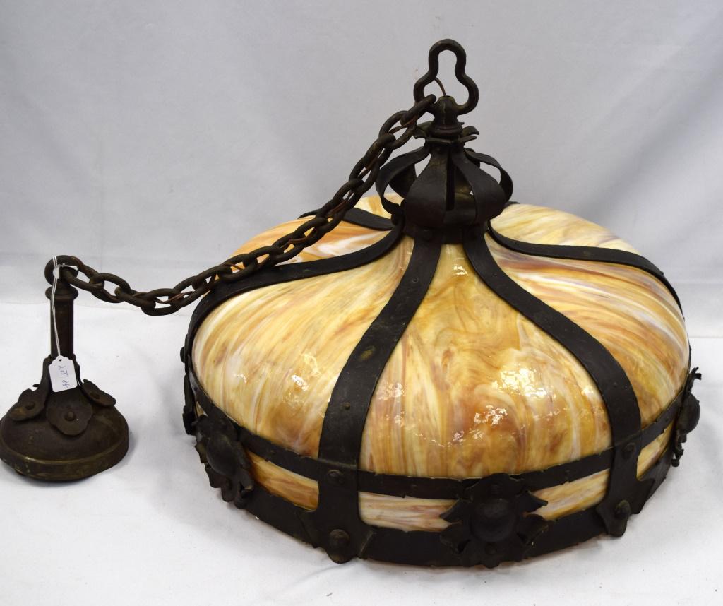 ARTS AND CRAFTS HANGING LAMP: Ca 1900. 6 bent panel carmel slag glass with hammered brass with floral accents. Six light fixture with acorn pulls. 26 inches diameter. Heavy well built arts and crafts fixture. Goodcondition no crac
