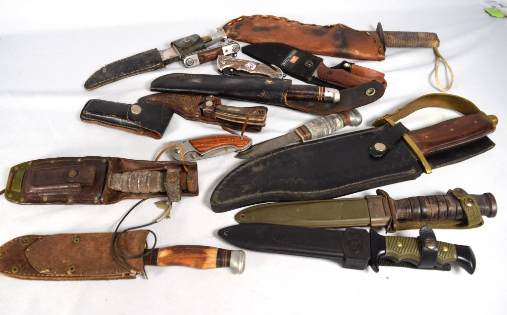 LARGE GROUPING OF KNIVES: Consists of 1) Bowie 16Â” Fixed Ole Smoky Blade Knife With Wood Handle Brass D-Guard. with sheath. 2) Ozark Trail and sheath, 3) USM8, 4) Remington, 5) Old Timer Schrade with sheath, 6) Unmark with