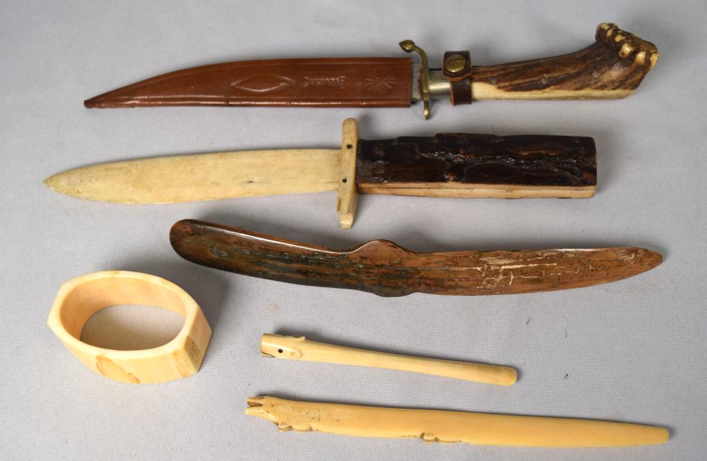 ASSEMBLED ESKIMO AND MISC. PEICES: Consists of Eskimo seam rubbing tool. Carved walrus face napkin ring, Cigarette figural holder, Figural letter opener (Chipped), Stag handle knife, Bone knife. Various conditions