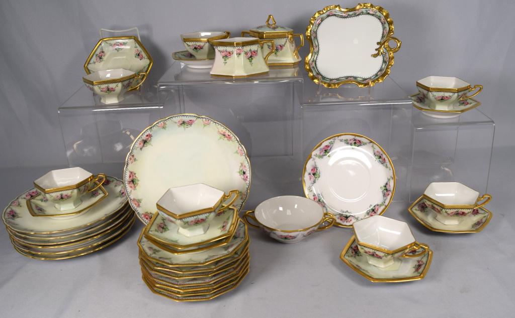 HAND PAINTED PORCELAIN LUNCHEON & ETC.: Assembled hand painted porcelain with gold trim and handles. Painted pink roses. pieces of Limoges and Bavaria porcelains. 7 sandwich plates, 7 plates, 7 cups and 8 saucers, Creamer and sugar,Bullion 