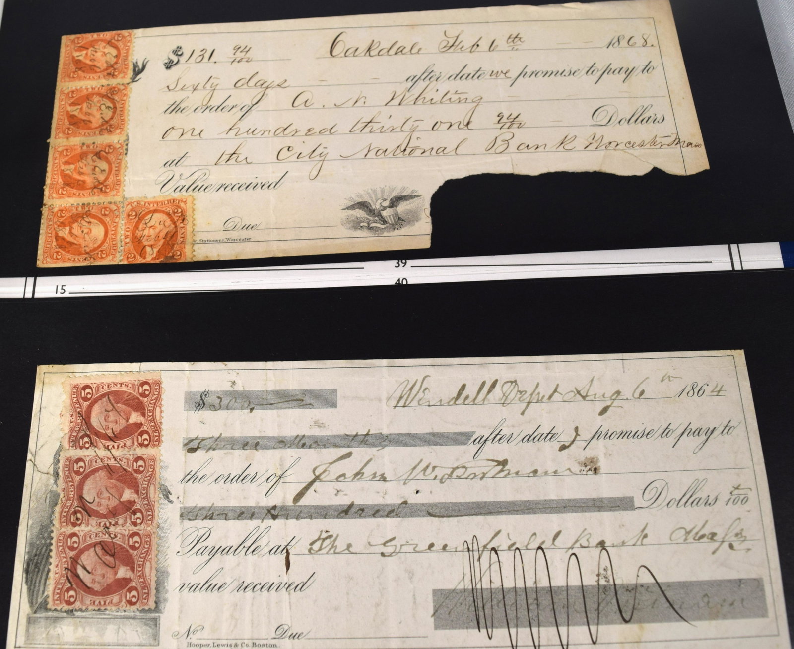 RECEIPTS, LETTERS & CANCEL CHECKS with REVENUE STAMPS: Assembled in a 1980s dark blue binder. 51 pages in clear protective page covers. Ca. 1860's-1890. Many of the stamps first issue. Consists of 182 receipts and correspondences of merchants with adverti