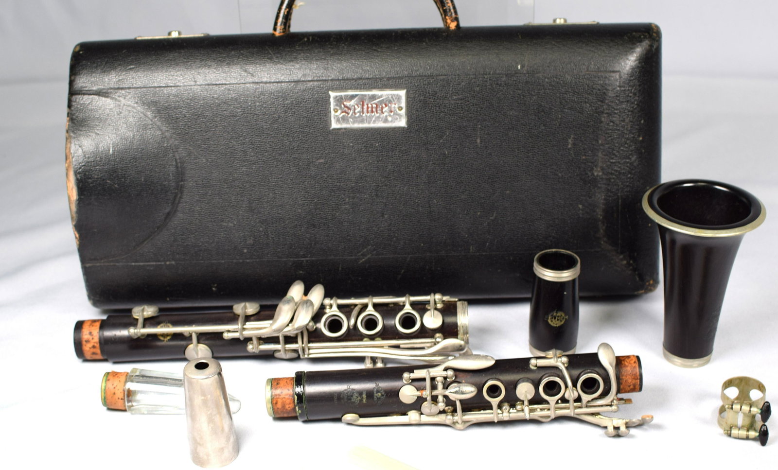 VINTAGE HENRI SELMER, PARIS CLARINET: Nickel silver mounted clarinet with velvet lined case. Good condition.