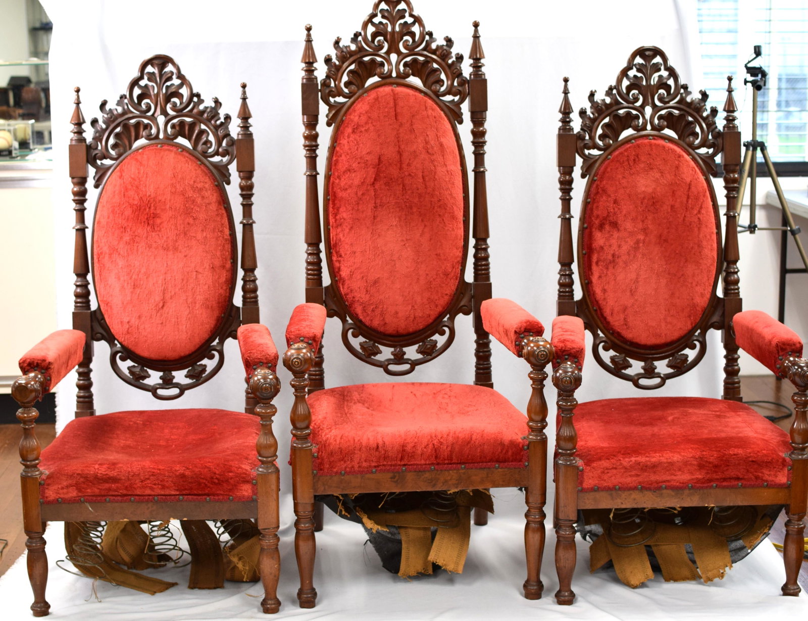 THREE GOTHIC CHURCH CHAIRS: Ca 19th century. Three pieces with red velvet. Tallist 58 inches. Springs loose and repaired back. Mahogany.