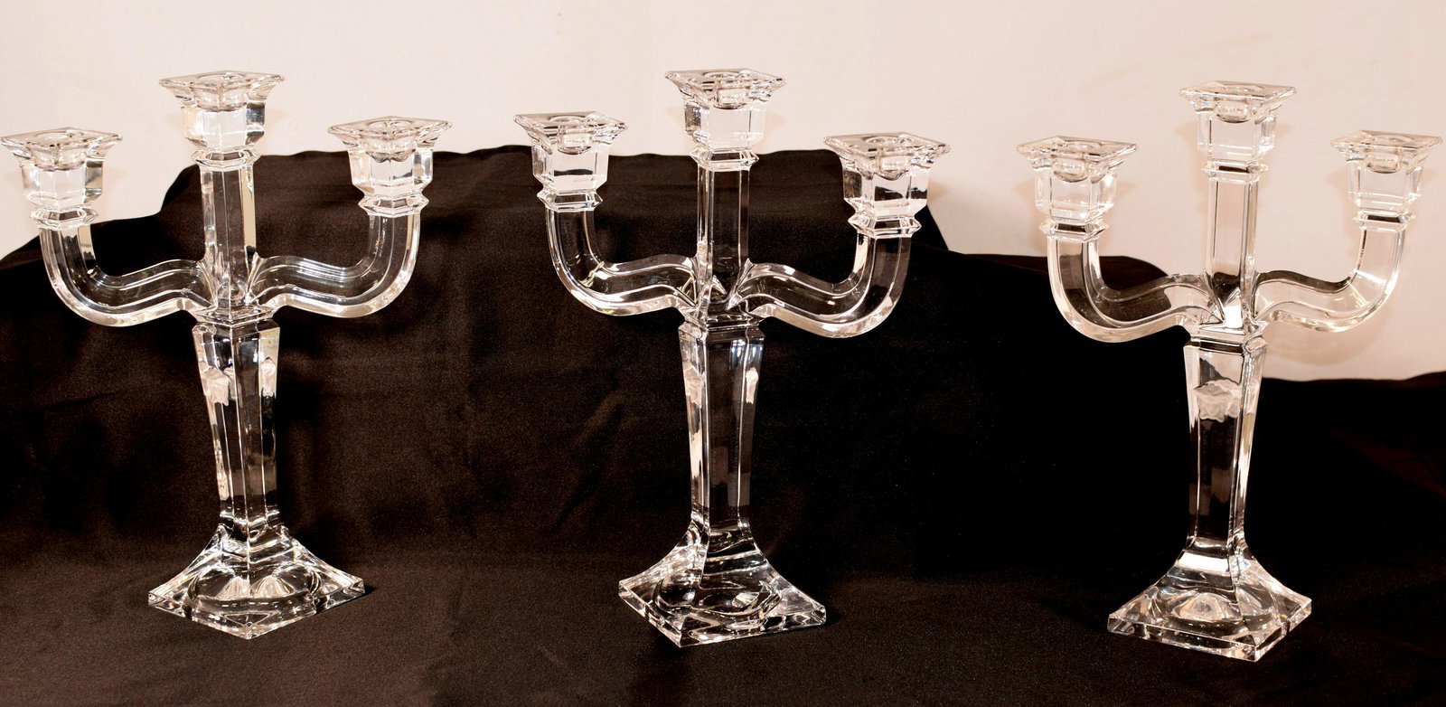 (on-3) VERSACE ROSENTHAL CRYSTAL CANDELABRAS: Solid crystal body with three candle holders. Each with double frosted Medusa heads. Signed Rosenthal Versace. Ca. 20th century. German. 12 inches tall x 9 1/2 wide. One has small chip onebase corner.