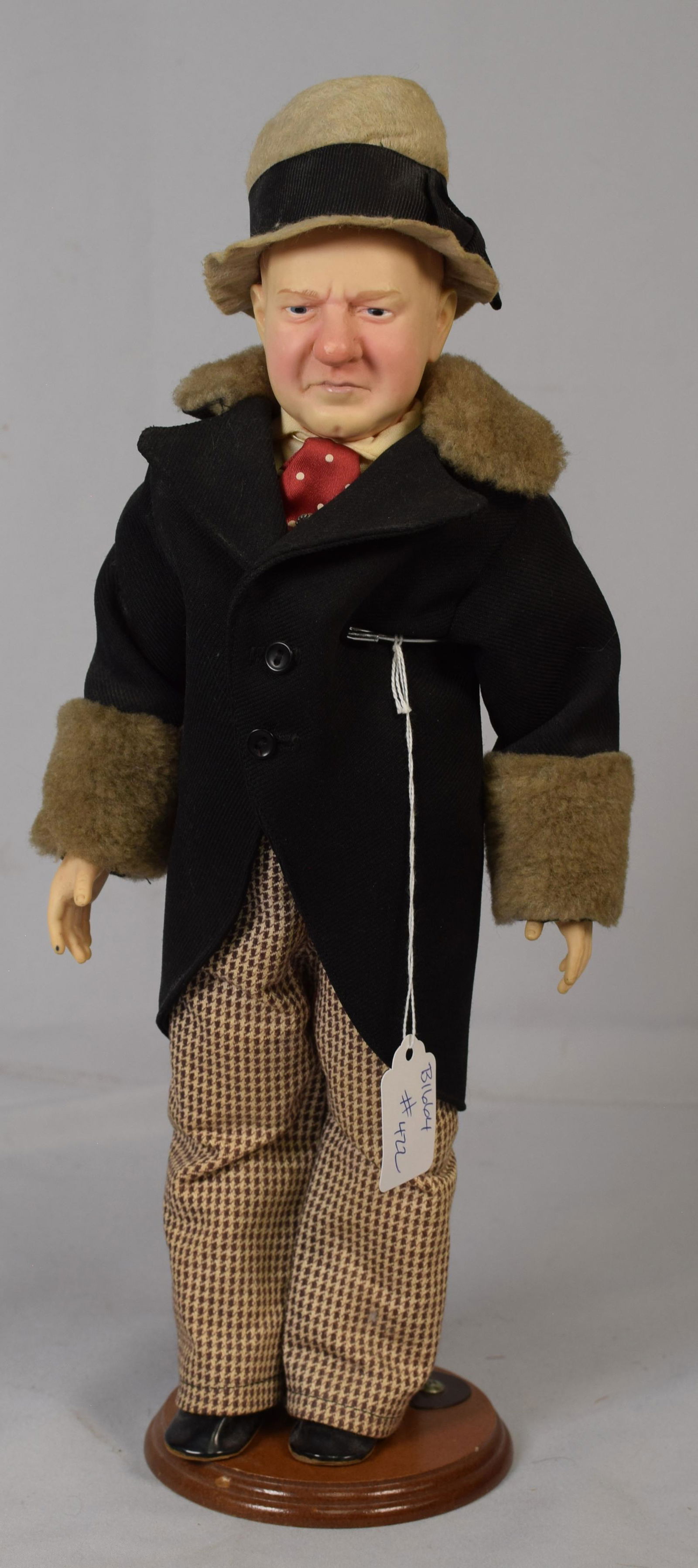 EFFANBEE W.C. FIELDS CHARACTER DOLL: 20th century Effanbee W. C. Fields vinyl doll circa 1980. 16 inches tall on stand in original clothing. Some damage to hat and missing walking stick. Good condition.
