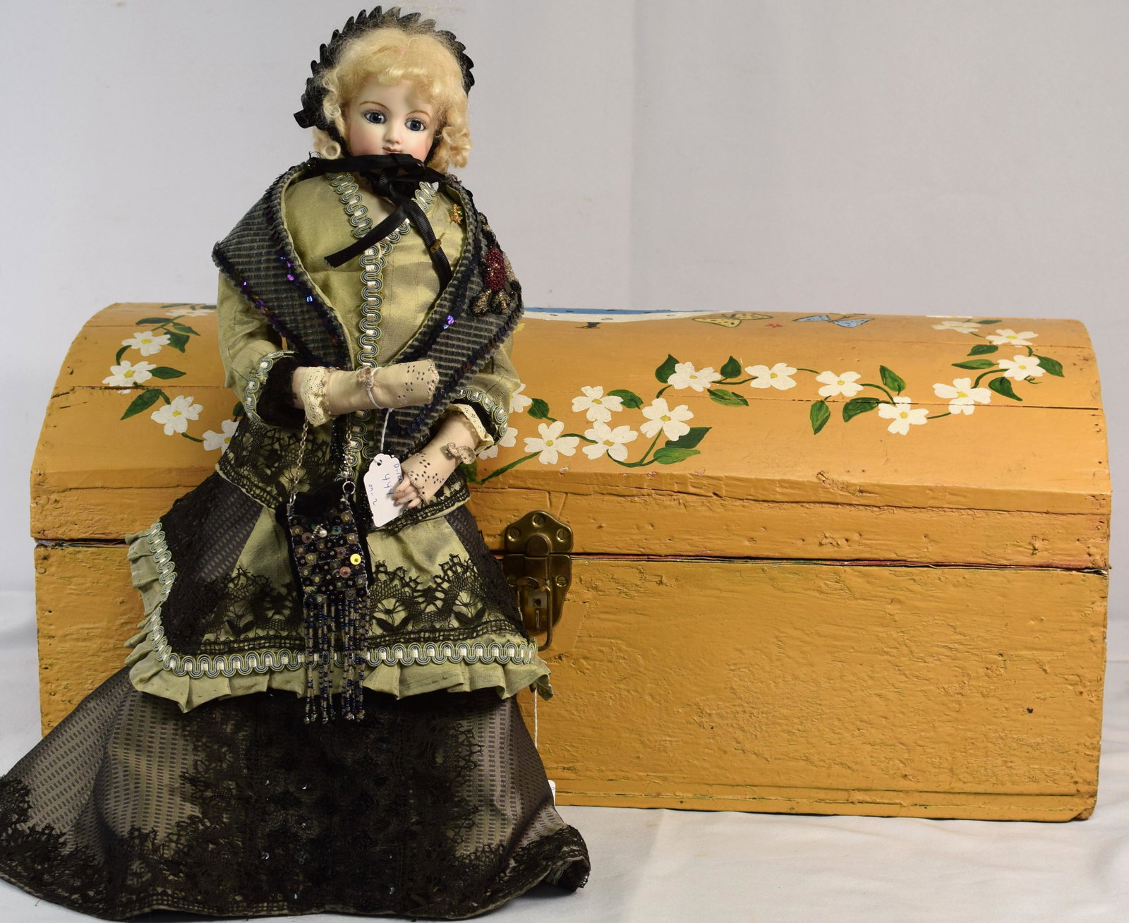 REPRODUCTION BISQUE HEAD DOLL WITH RECLAIM TRUNK: Antique doll top trunk re-claim has doll trunk. Yellow with bird and painted flowers. 28 inches long. Good condition. 1) 21 hand made pieces of clothing. 9 hat and accessories pieces. 2)Reproduction b