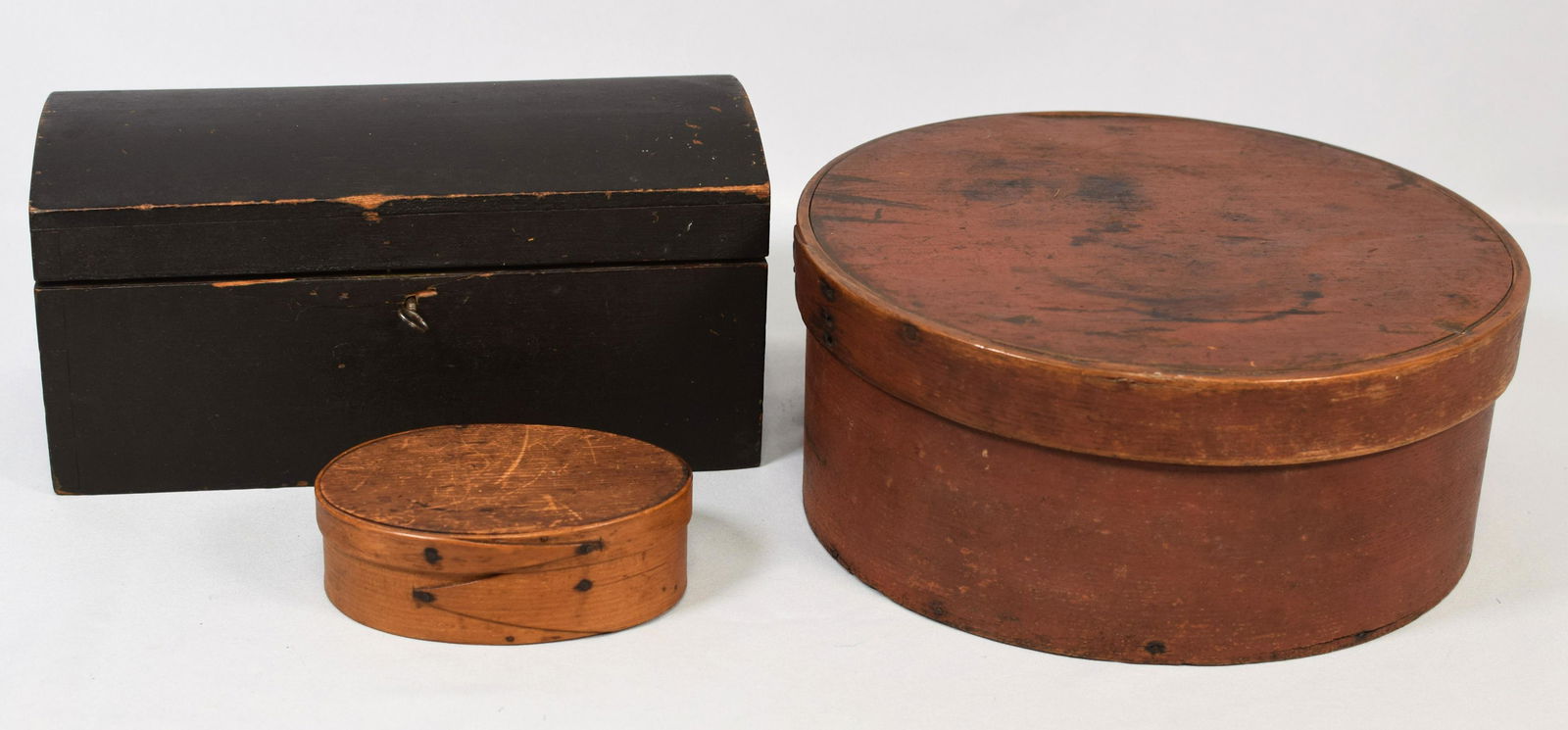 ON (3) AMERICANA WOODEN PRIMITIVE ITEMS: Consists of 1) Small painted dome dovetail construction document box. 12 inches long x 5 3/4 inches tall x 6 inches deep. Has original key. Pine 18th/19th century New England. Dark originalpaint. Good