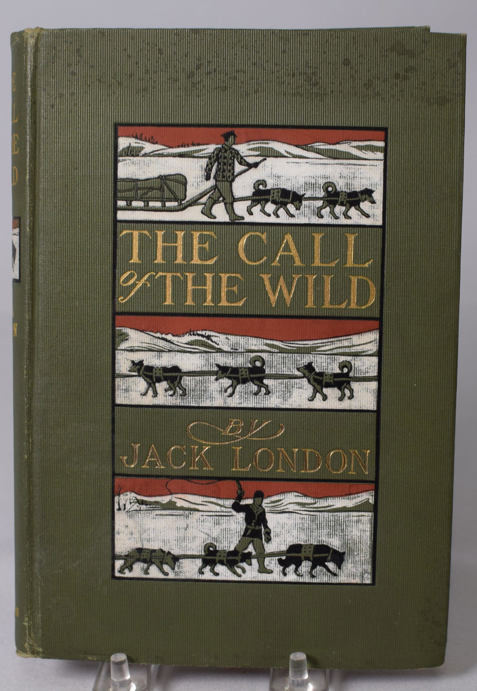 1ST EDITION THE CALL OF THE WILD 1903 JACK LONDON: A very clean copy of a 1st edition of The Call of the Wild by Jack London. Pictorial green cloth boards with gilt lettering and black, white, and red illustration on front and spine. This is acomplete