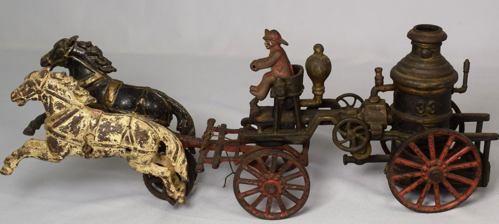1883 HORSE DRAWN FIRE PUMPER WAGON TOY: Hubley Ives early cast iron American pull toy. Fire Engine No. 33 Pumper Wagon. Two-horse team, 18 long. Original condition.
