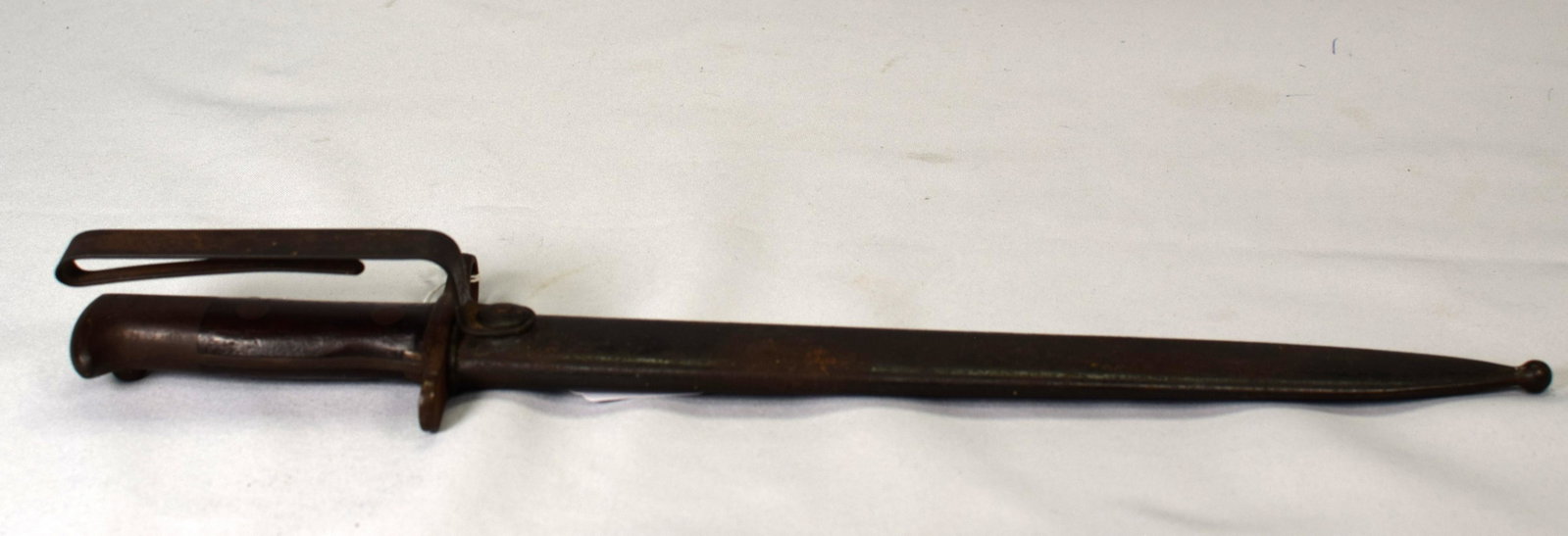 US ARMY SPANISH AMERICAN WAR BAYONET: US Army Spanish American War bayonet complete with scabbard for use with Krag rifle, a wood and metal handle and metal belt attatchment. Blade stamped US on one side with manufacturing date of1894 on 
