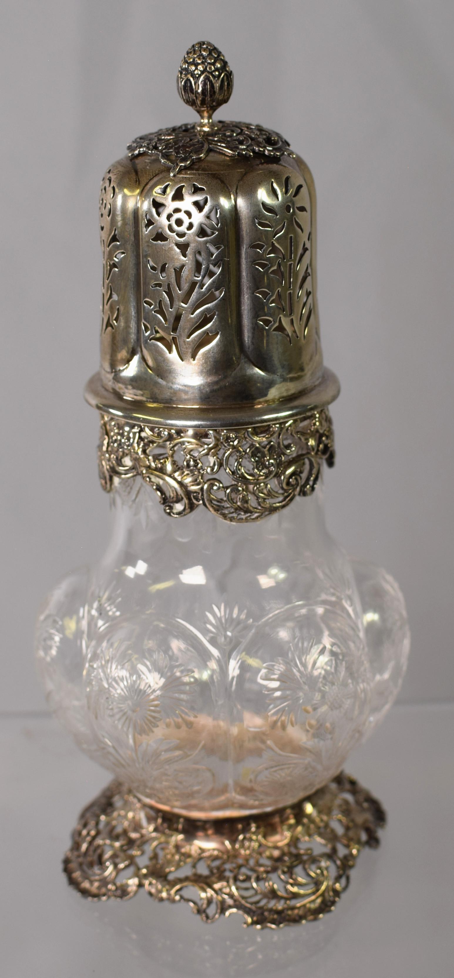 EDWARDIAN SILVER & EDTCHED GLASS SHAKER: Ca 1905. Ornate silver scroll foot and collar. Openwork top with floral decoratin and flower bud finial. Gourd shape glass body with etched floral decoration.Measures 7 1/4 inches tall. English hallma