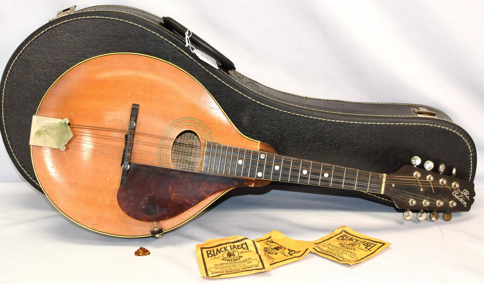GIBSON MANDOLIN #79852 STYLE A2: American Mandolin, Gibson Mandolin-Guitar Company, Kalamazoo. 8 string. Paper label inside with model and serial number. Early model. 1920's. 25 1/2 inches long. Missing a bone piece along sideof neck