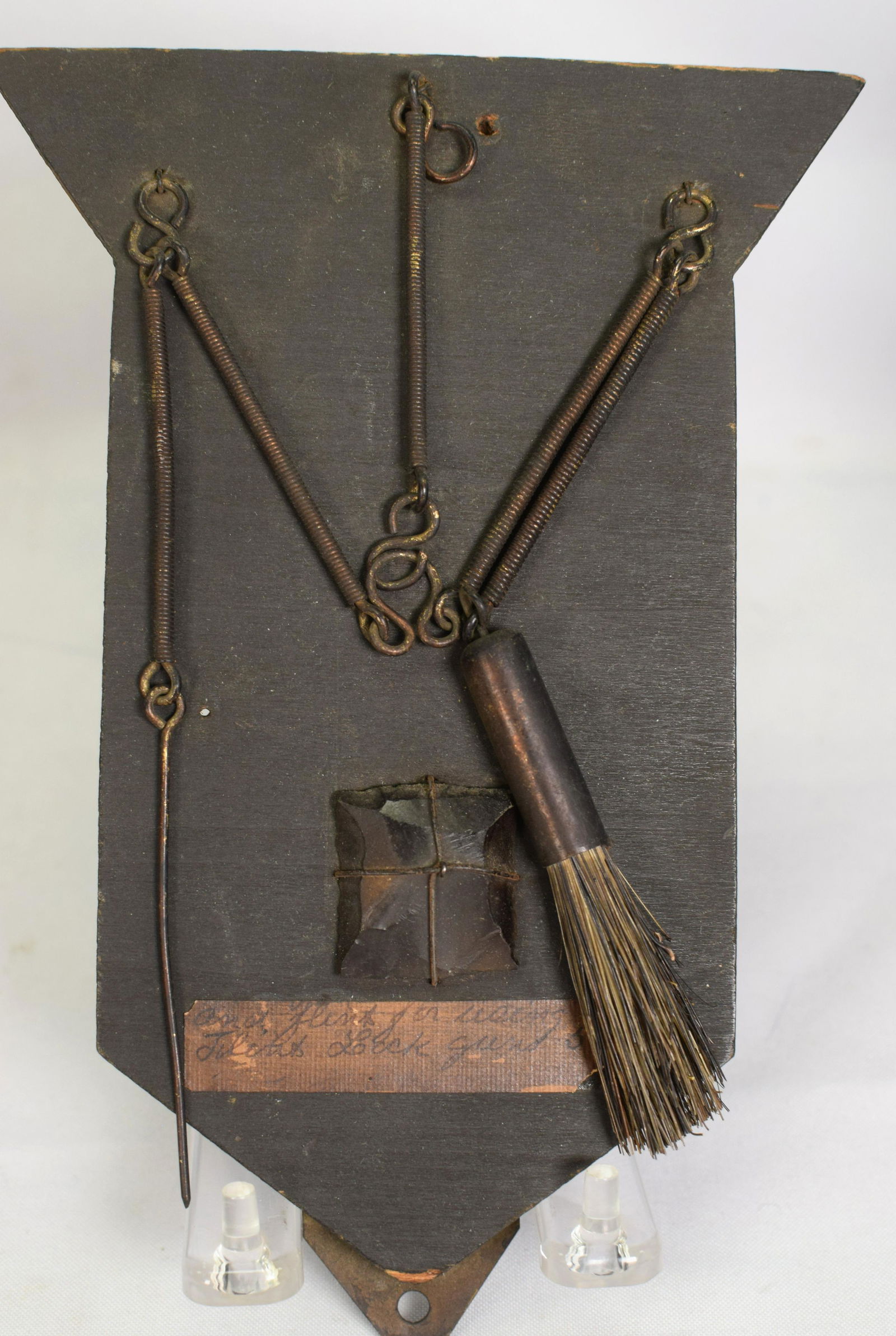 REGULATION US ISSUE VENT PICK, FLINT & BRUSH SET: Frame or mounted on wood plaque with identification papers. Regulation U. S. Issue Vent Pick and Brush Set for the M1816/22 Flintlock Musket. Label on back US Army Regulate pick, brush and flint. Used