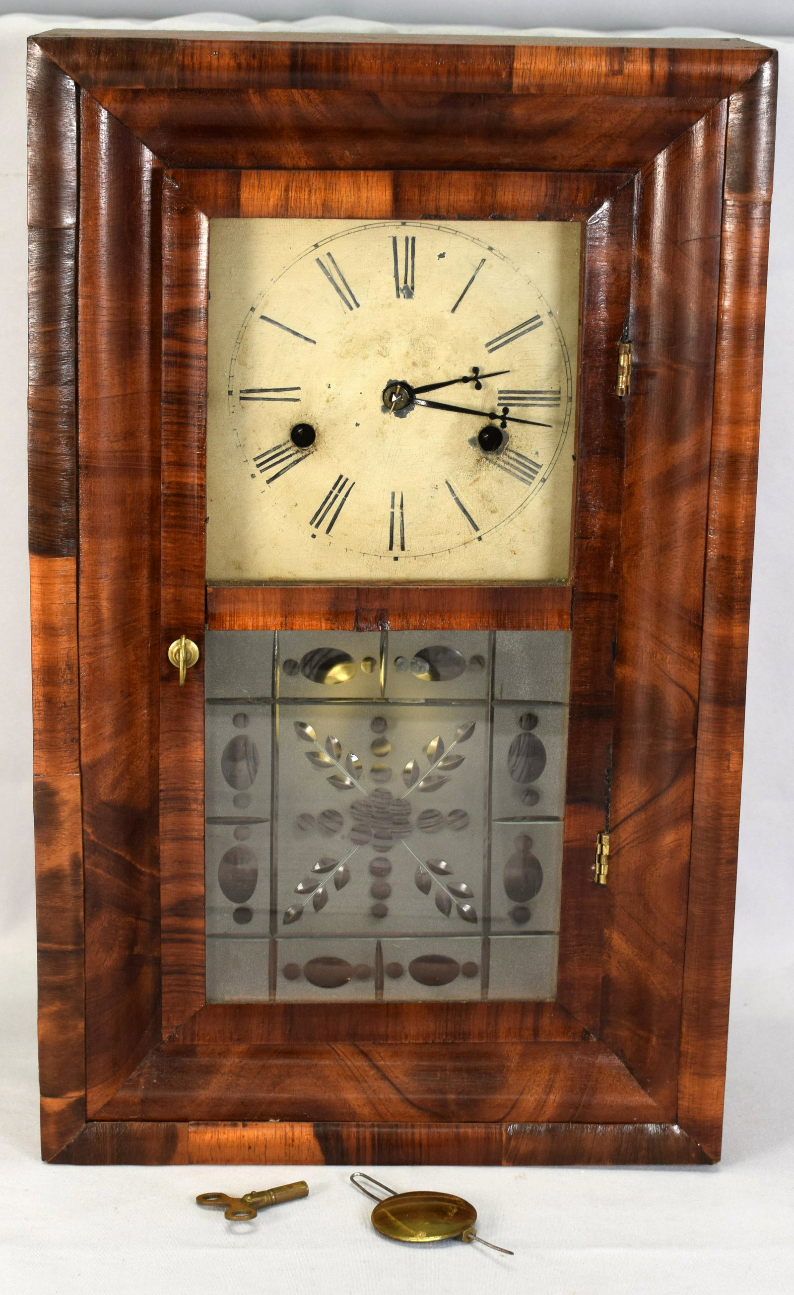 J.C BROWN MINIATURE OGEE CLOCK: Rate J.C. Brown, Bristol, Conn, miniature Ogee clock. Rosewood and rosewood veneer case. 30 hour fusee movement. Painted metal face with Roman numerals (minor craquelure and discoloration).Exceptional
