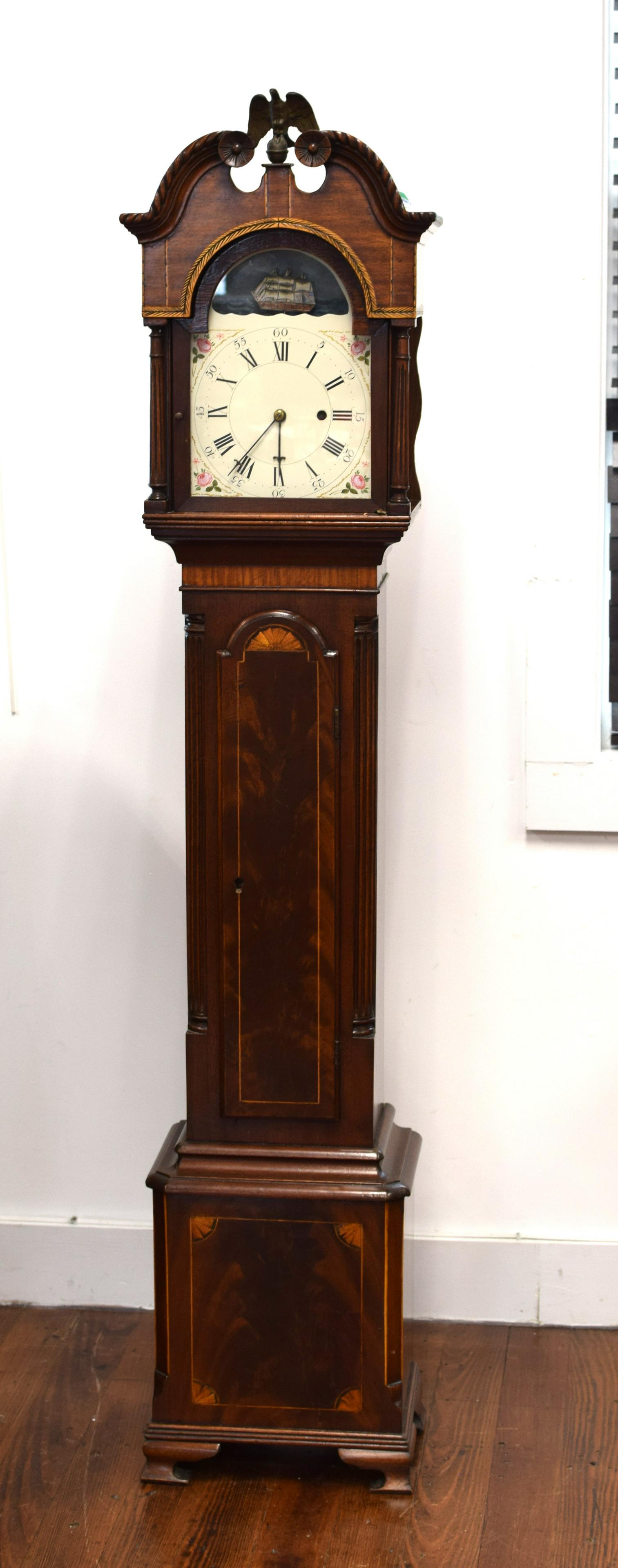 E. HOWARD, BOSTON MINIATURE/GRANDMOTHERS CLOCK: Chippendale-style "grandmother" clock, inlaid mahogany, scrolled-arch pediment with floral rosettes and gadroon borders, tombstone door with conforming inlaid bonnet, central section withreeded quarte