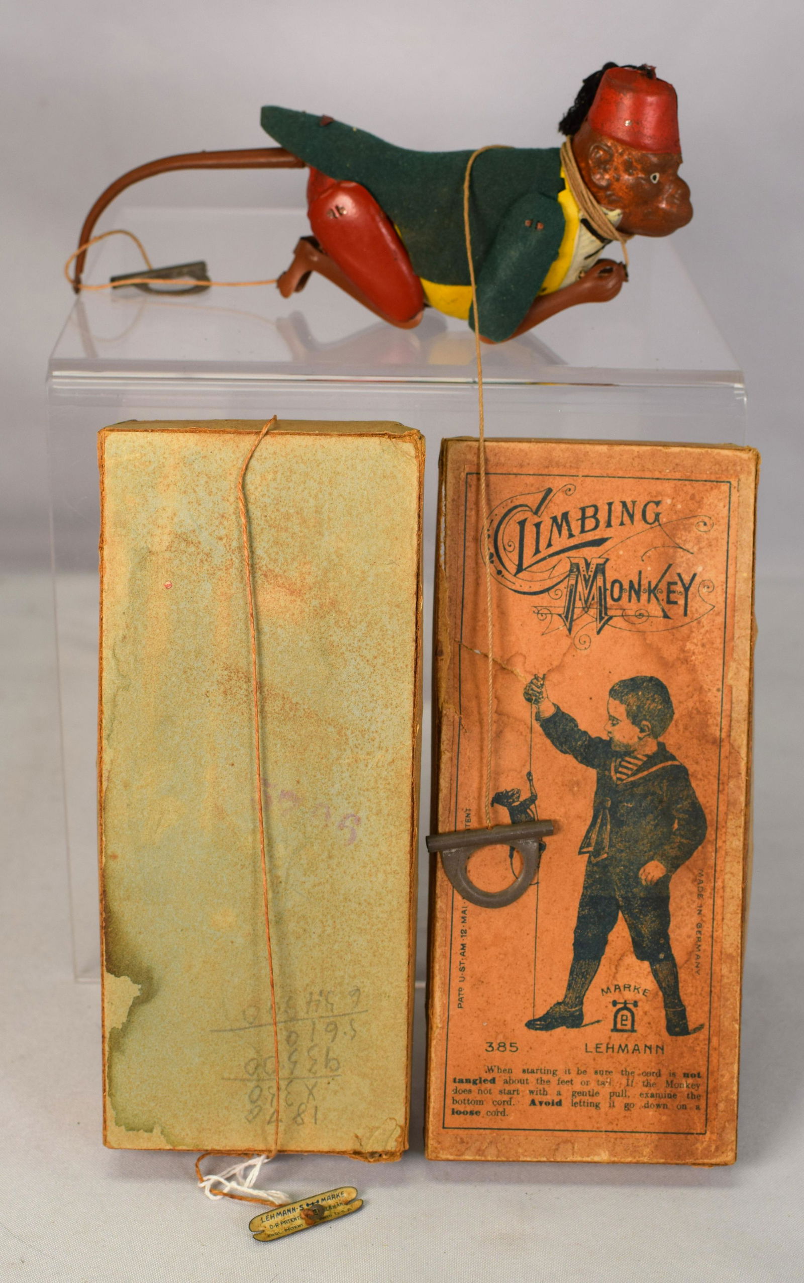 BOXED LEHMANN 1903 CLIMBING MONKEY TIN TOY: Wonderful 1903 Marke Lehmann Germany tin CLIMBING MONKEY toy in its original box. The toy is in pretty much unused condition. Almost no discoloration and NO paint loss. Box is intactwith some separati