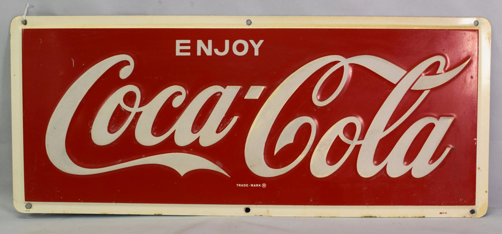 VINTAGE ENJOY COCA-COLA ENAMEL TIN SIGN: Very clean, vintage Enjoy Coca-Cola enamel sign. Minor paint fading around letters. Colors are bold. Nice sign. Measures 10 x 24 in.