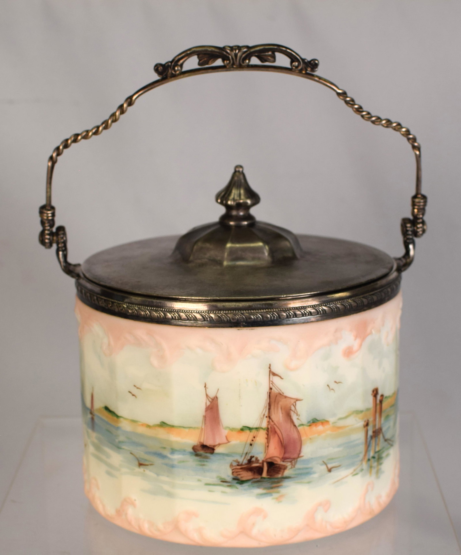 MT WASHINGTON CRACKER JAR OPAL SAILBOATS: Mt. Washington cracker jar, the paneled opal body with molded scrolling, decorated with sailboats, birds, cliffs and background, correct stamped Pairpoint lid, 6 1/2 inches ht. Very goodcondition, lid