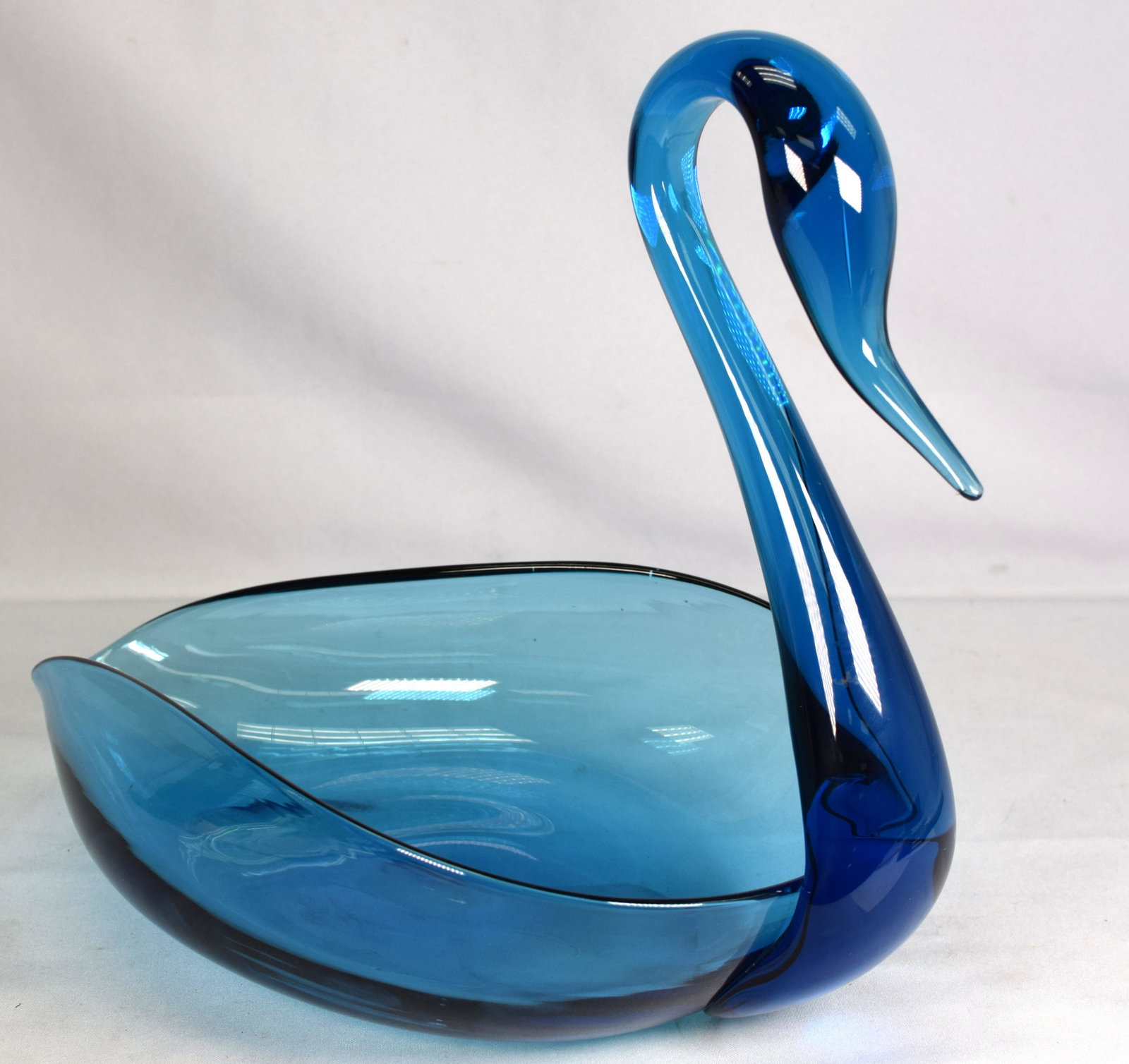 LARGE RARE PAIRPOINT BLUE COLOR GLASS SWAN: Pairpoint Gunderson large blue glass swan. 14 inches long x 12 inches tall. Ground pontil. Good condition, some small white paint spots.