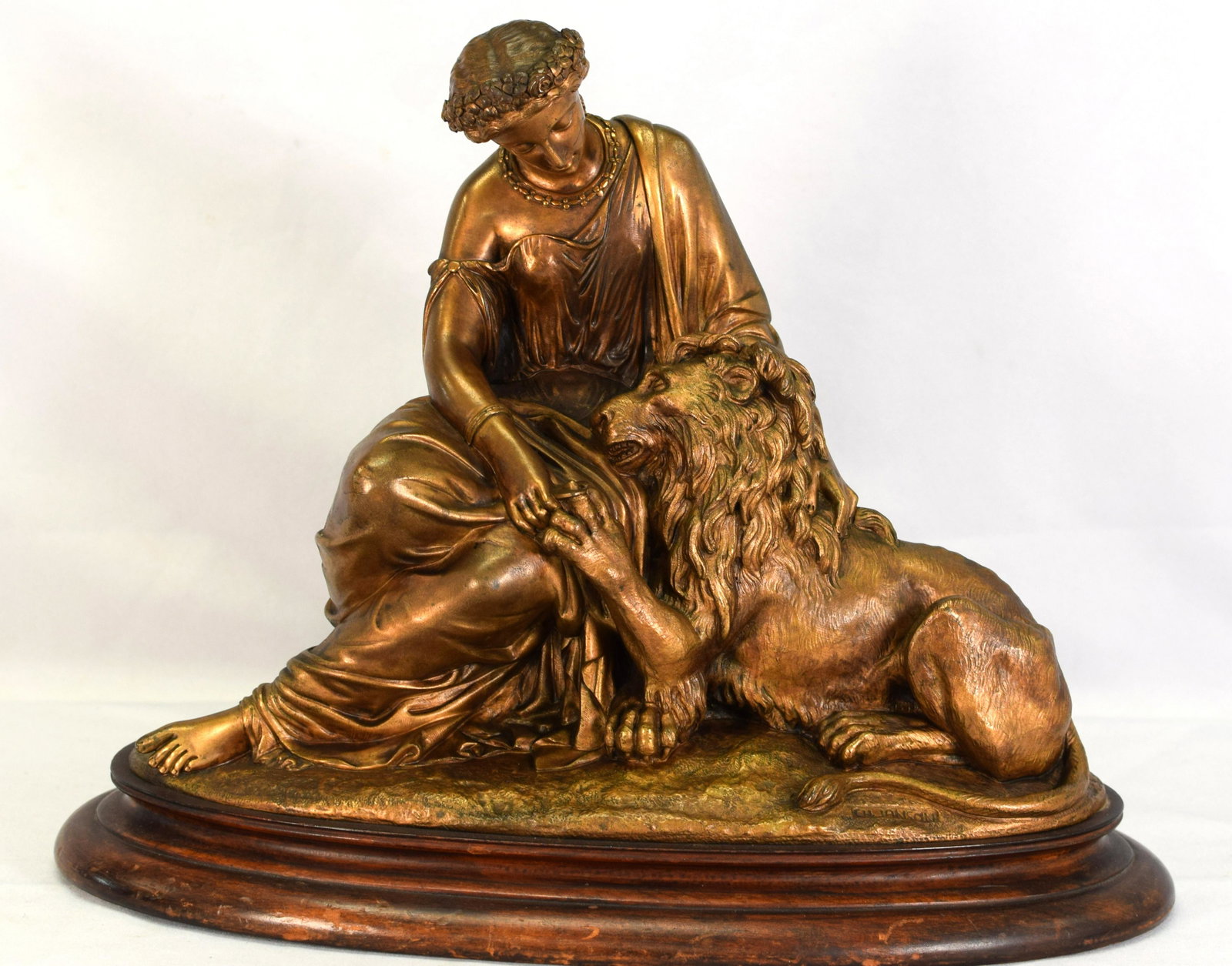 CH JANSON 19TH BRONZE OF DIANA & LION: Louis Charles Janson (1823-1881) Mid 19th century French patina bronze sculpture. Cast signature CH JANSON. Classical figures. Believe Diana and the lion. Mounted on wood oval base. Diana cuttinglions