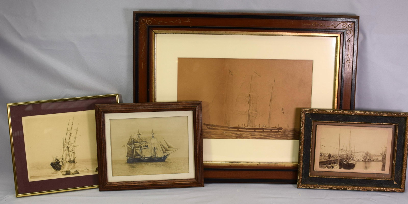 LOT of 4 FRAMED AND IDENTIFIED WHALER PHOTOS: This is a lot of 4 framed and identified whaling ship photographs. There are 3 smaller and 1 large. The 1st is a photo of the Bark Canton, oldest whaler, 66 years afloat, and 56 as awhaler. 9 1/2 x 11