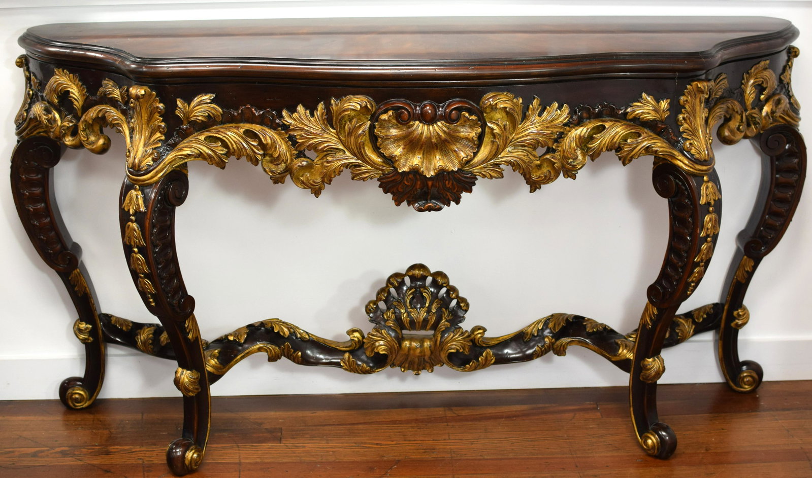 THEODORE ALEXANDER CARVED CONSOLE TABLE: This is a very ornately carved, wood and gilt console table. Serpentine front, snail scroll feet, and carved throughout. If you are familiar with Theodore Alexander, then you know the quality of their