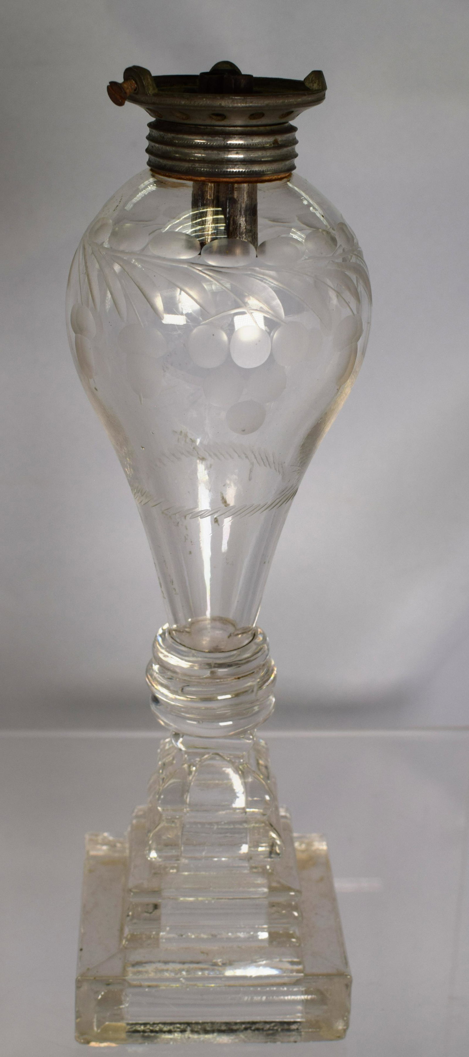 FREE-BLOWN, CUT & PRESSED GLASS WHALE OIL LAMP: Original double burner set-up. Colorless, bulb-form font with bold grape, acorn and cable pattern repeated three times, on bladed wafer construction, original pewter collar. Fitted witha double-tube b