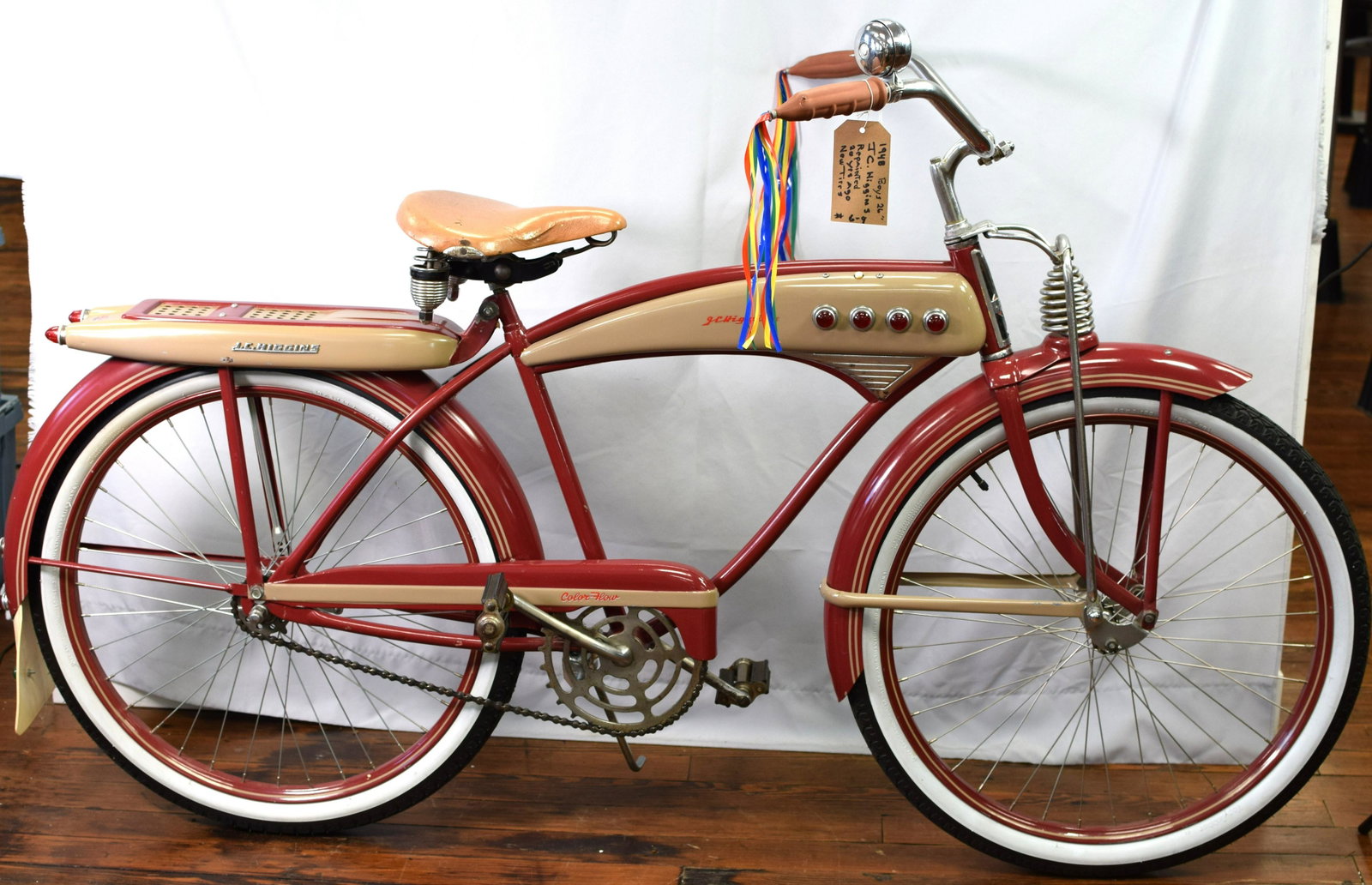 1948 J.C. HIGGINS COLOR FLOW BICYCLE: Original 1948 boys 26 inch bicycle. Color Flow, red and tan. Springer front end, red tank, jewels, rear mud flap and reflectors, Skip Tooth Sprocket, bell and push button horn. Originalsignatures and 