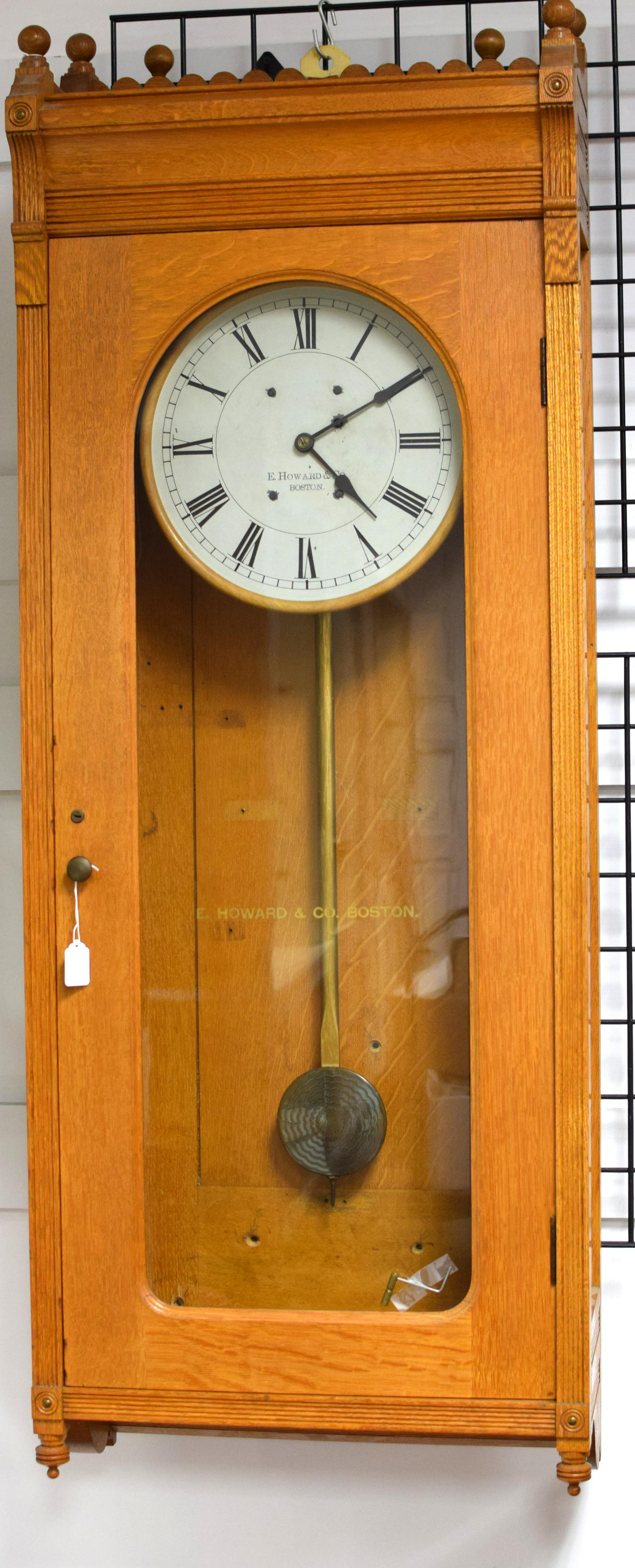 E HOWARD REGULATOR NO. 89 CLOCK: E. Howard, Boston Number 89 regulator clock. DIal has Roman numerals, marked E. HOWARD & CO, BOSTON. Dimensions: (dial) 11 3/4 in diameter. Height, overall approx 60 in. x w21.5 in x d10 3/4 in. Glass