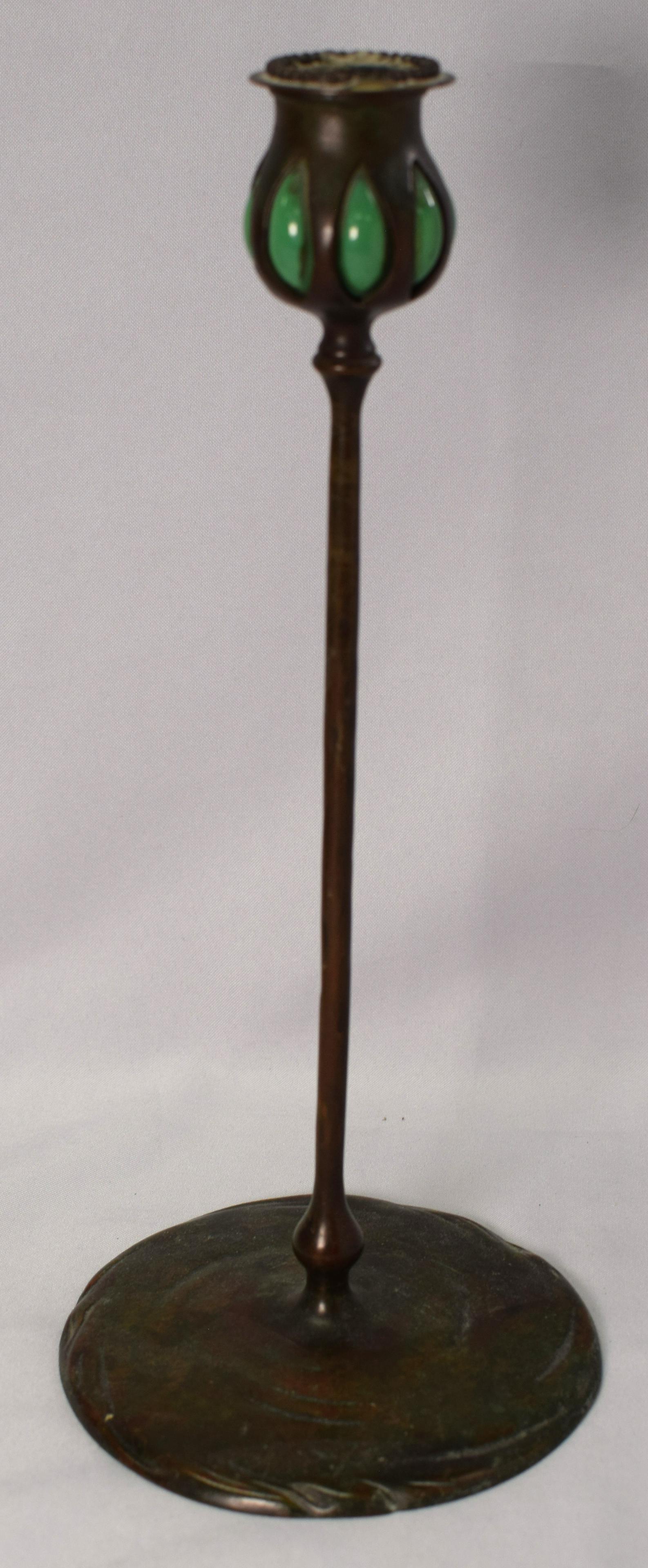 TIFFANY STUDIOS BRONZE & GLASS TALL CANDLESTICK: Circa 1910. Favrile glass with patina bronze. Impressed 3900/TIFFANY STUDIOS/NEW YORK. 6 x 6 x 13 1/2in, 2lbs. Good condition.