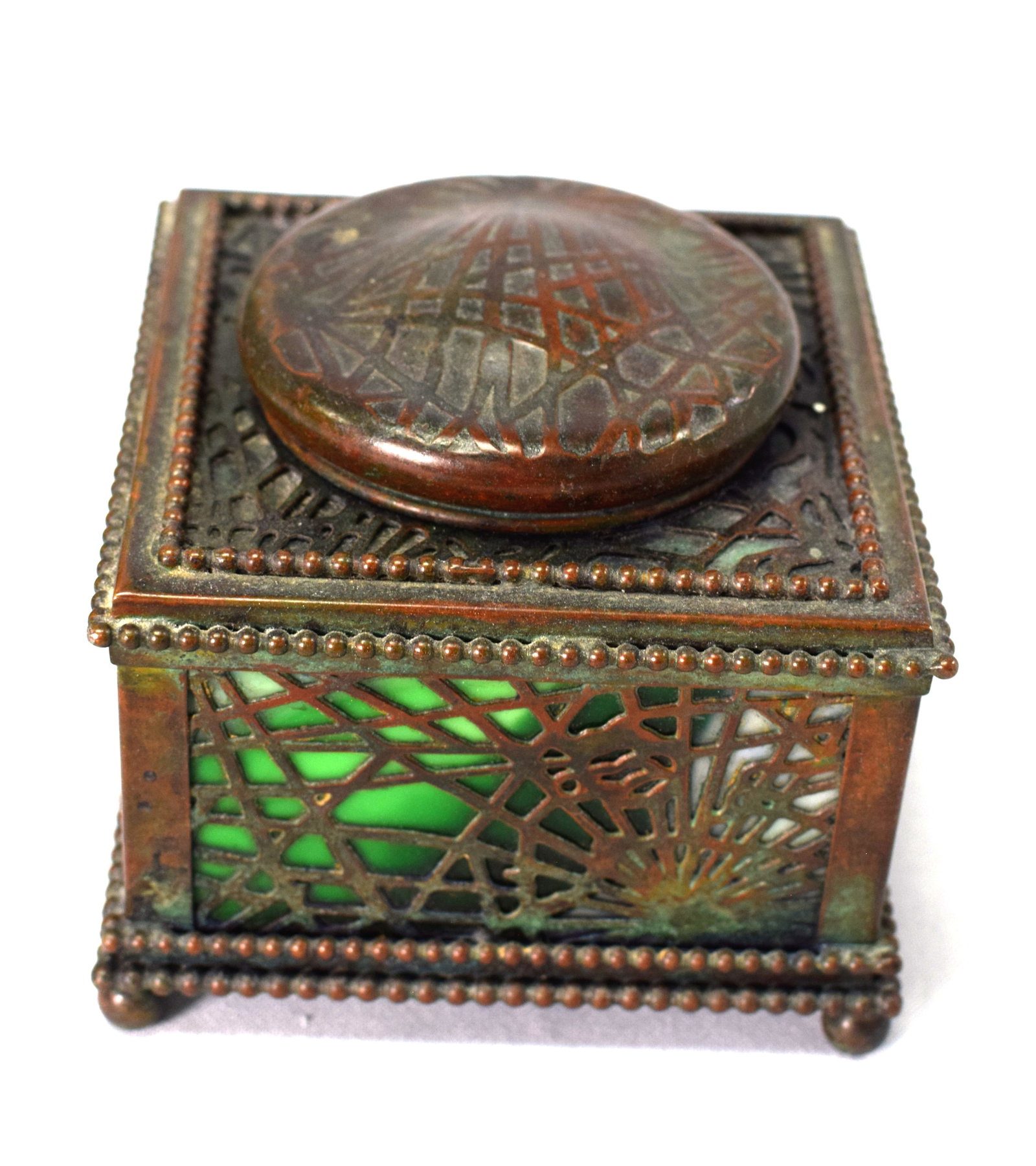 TIFFANY BRONZE & GLASS PINECONE PATTERN INKWELL: Impressed mark Tiffany Studios New York #32. Original patina with original glass and original glass insert inkwell (very, very minor roughage on insert). 4 1/4 x 4 1/4 x 3 1/2 inches, 2lbs.