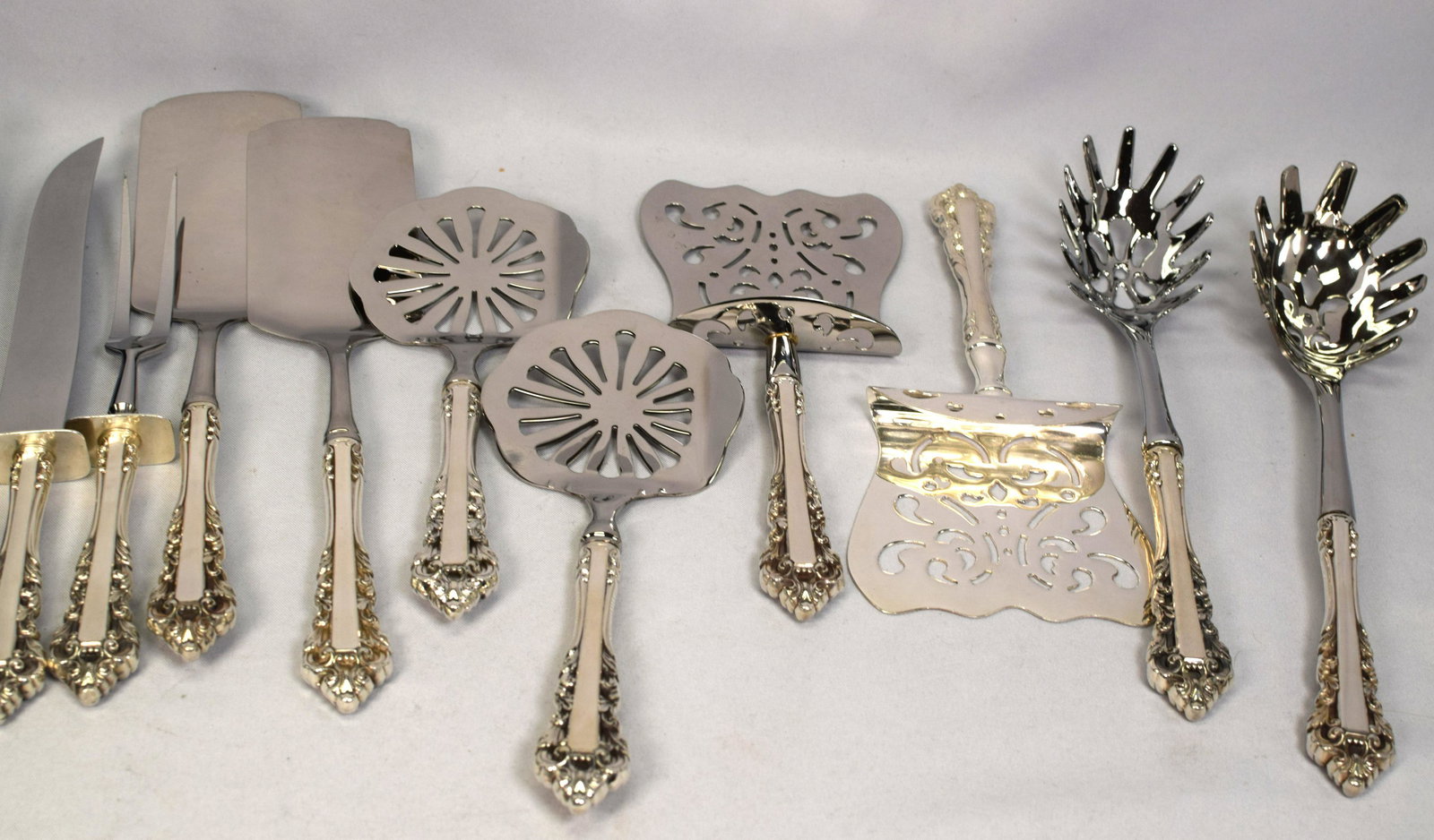 10 GORHAM MEDICI STERLING SERVING PIECES: Ten Gorham sterling and silver plate combination serving pieces including 2 Lasagna servers, 11 inches long, 2 Asparagus servers, 10 inches long and 2 tomato servers, 8 inches long, carving knife and