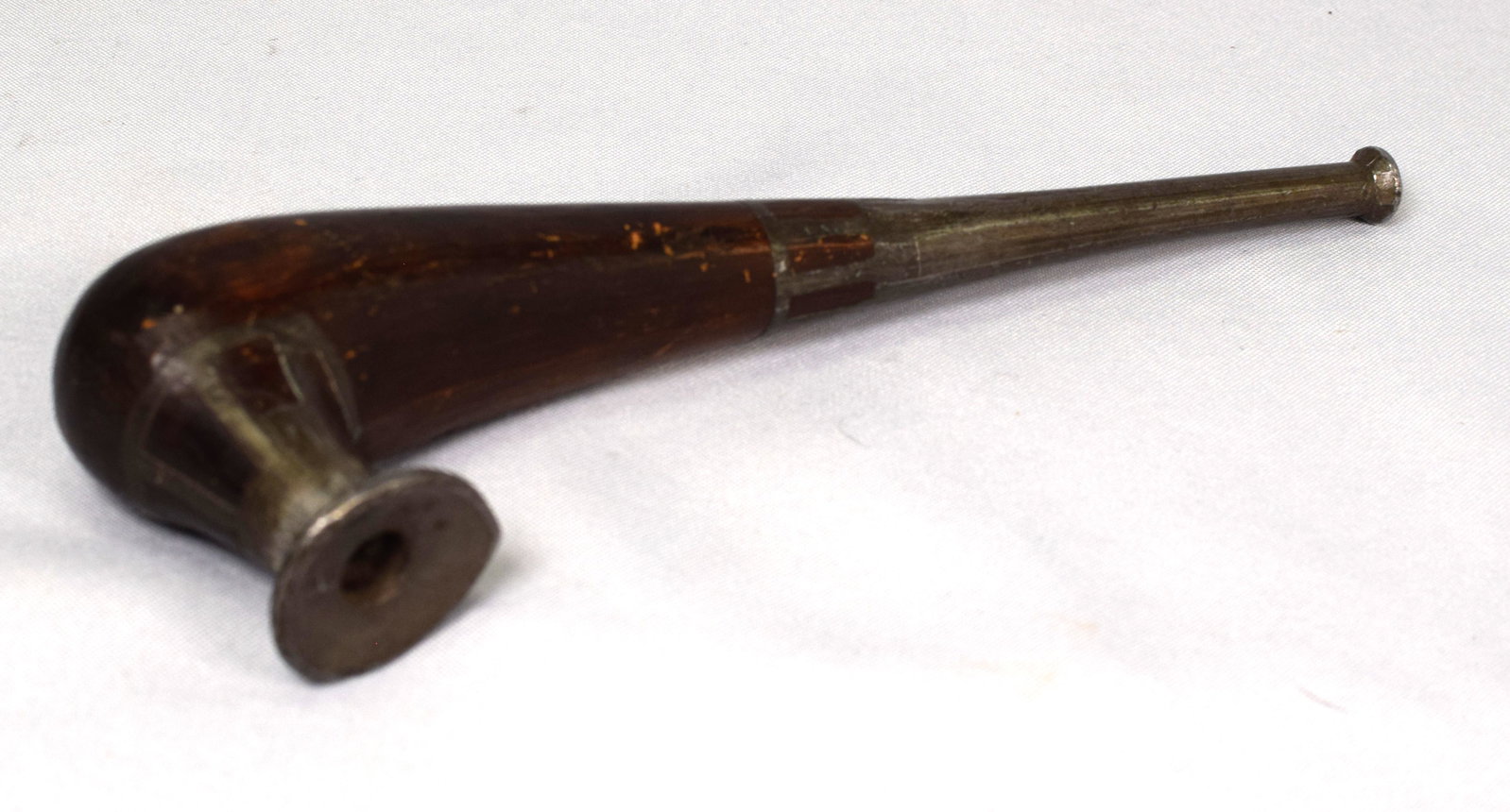 RARE 19TH BERING SEA ESKIMO SMOKING PIPE: Wonderful rich dark warm rosewood-like hardwood carved shape pipe. Pewter/lead inlaid pipe bowl and stem mouth-piece. 9 inches long. Siberia, Bering sea for Eskimo trade 19th century. With tar cleanou