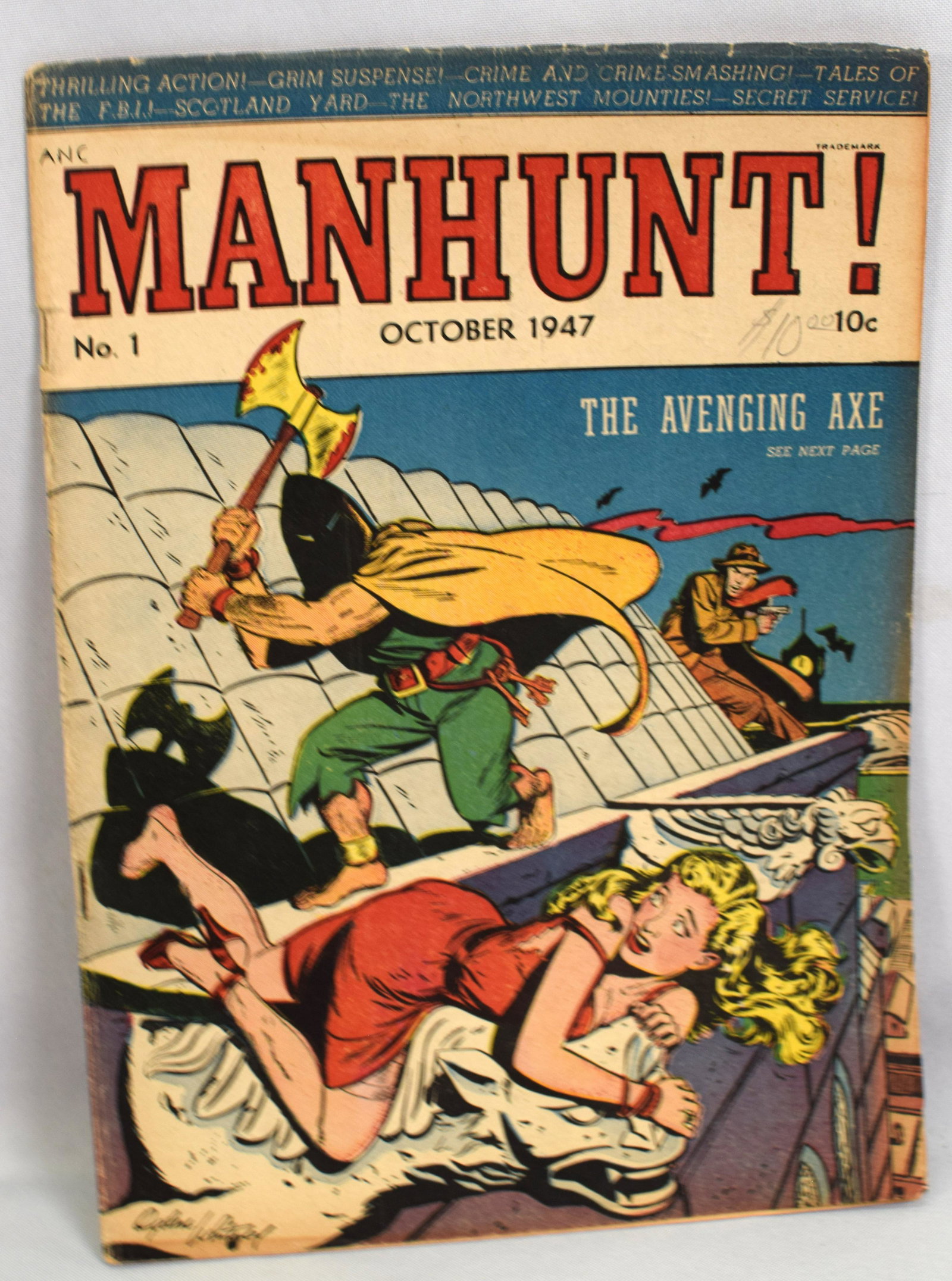 MANHUNT #1 COMIC BOOK: Manhunt October 1947 #1 comic book. Cover Edge wear, Small tear upper staple. Pencil mark $10.00Fold lower right corner. Back cover stain lower bottom and edge wear bottom. Interior good.All pages.