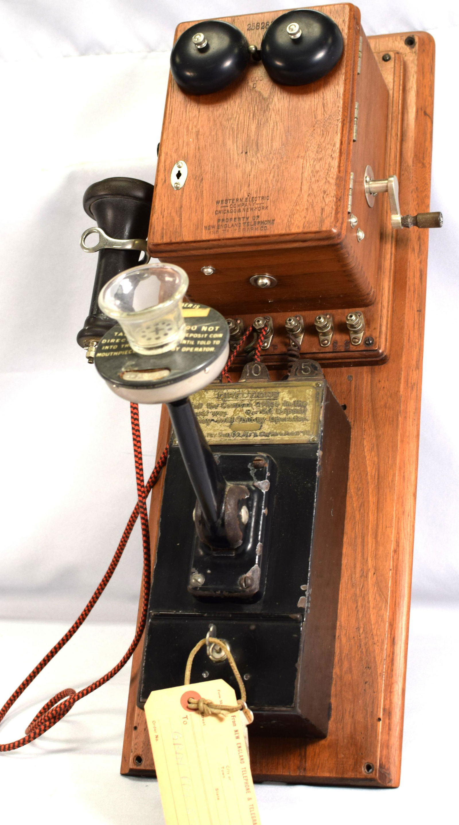RARE GRAY SILVER PAY STATION TELEPHONE: Ca pat'd date 1891. Impressed Property of New England Telephone "91" on walnut top with bakelite receiver. Walnut and black painted metal $.25, $.10, & $.05. Good condition 25 inches x 8 incheswide x