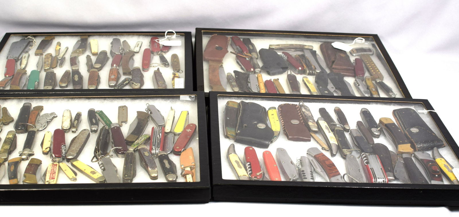 (on-126) ESTATE FOLDING POCKET KNIVES COLLECTION: Various makers and styles. Some with leather holders. Various as is. Estate folding pocket knives. Approx. 28 pounds. Approx. 16 x 12 x 5 inches.