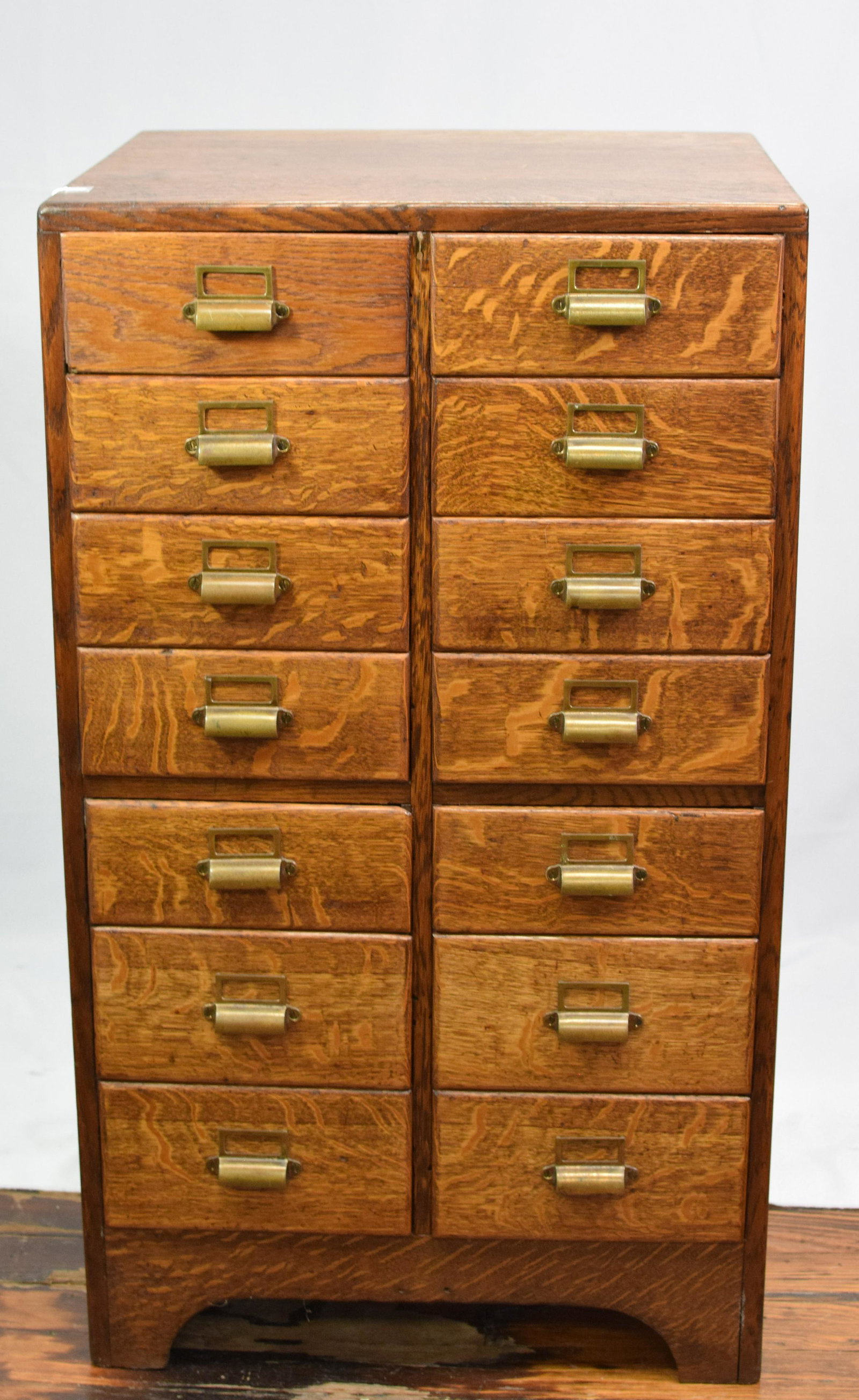 14 DRAWER QUARTERSAWN OAK FILE CABINET: Ca 19th/20th century. 40 inches tall x 23 inches wide x 20 3/4 deep. Good condition.