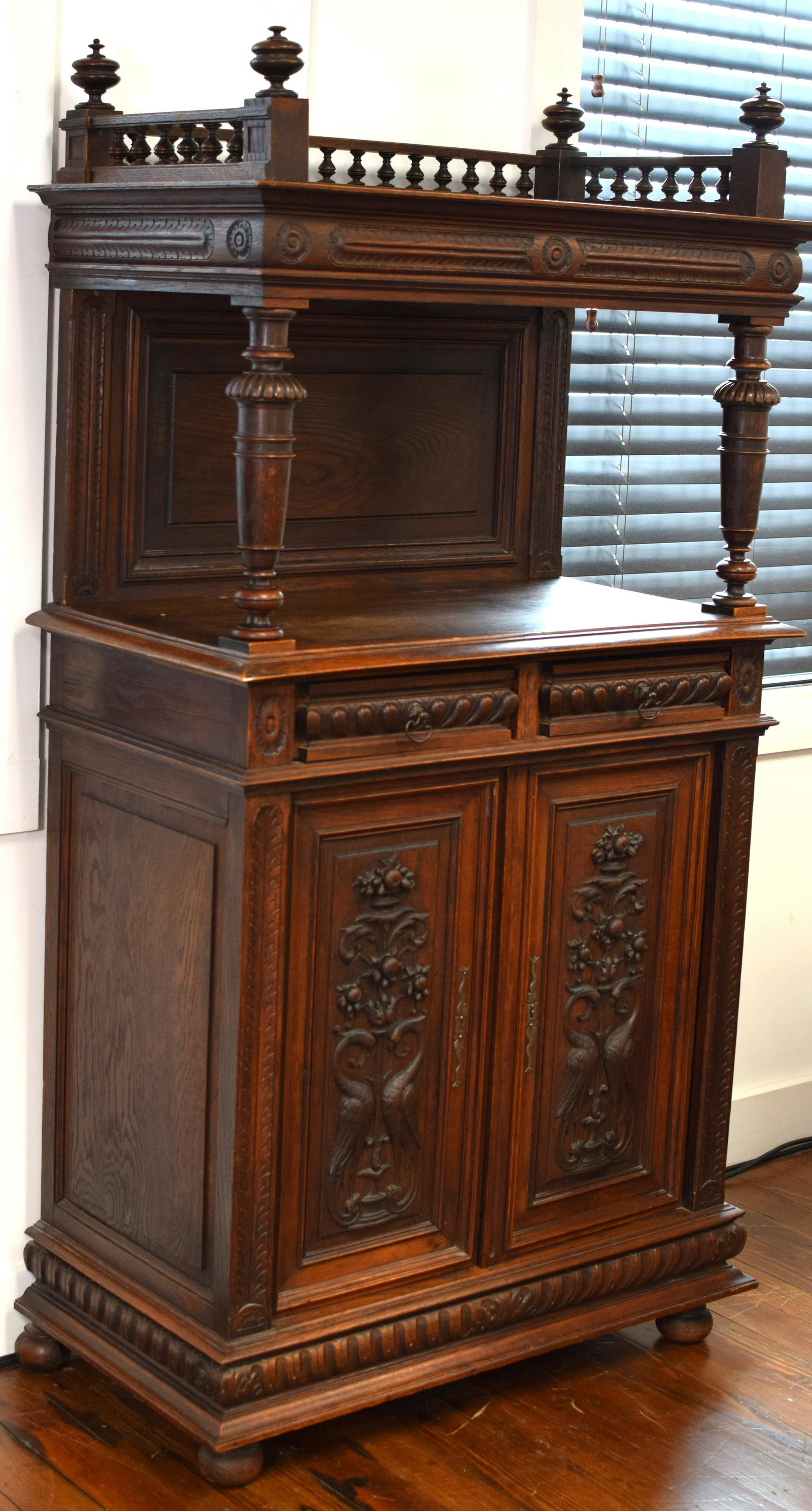 ANTIQUE HAND CARVED OAK SIDEBOARD: Ca. 1880's. French renaissance revival ornately carved sideboard. Unique and rare with superb carvings. Original with pegged construction. 64 1/2 inches tall x 35 inches wide x 18 1/4 inchesdeep. Has 