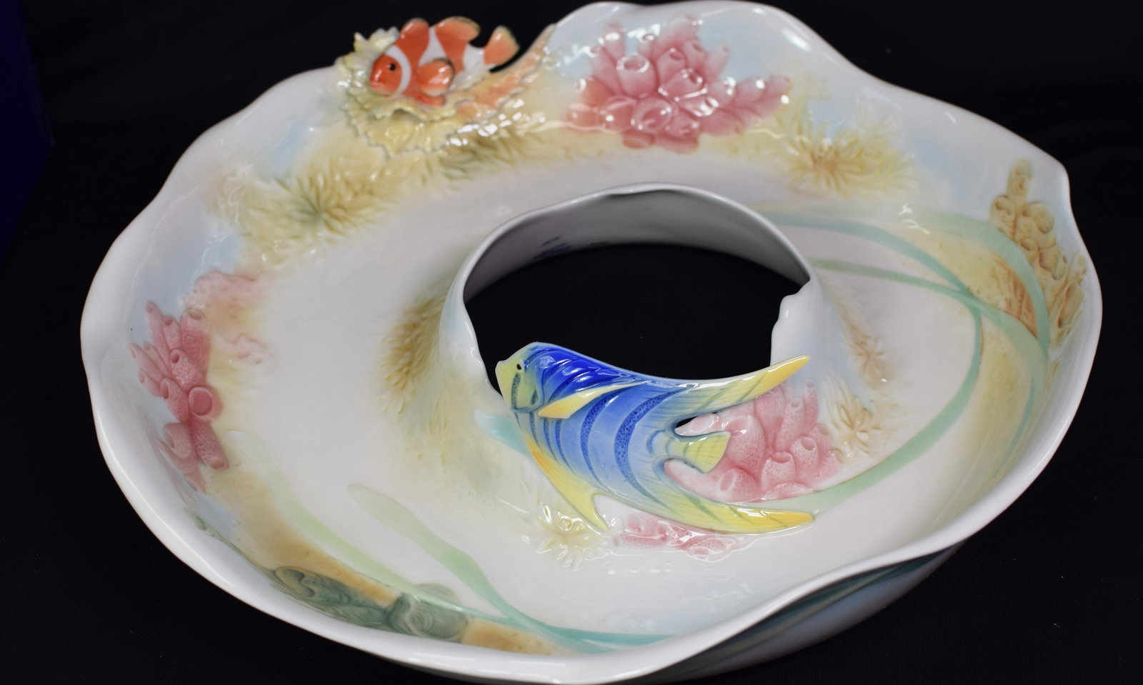 FRANZ PORCELAIN "BY THE SEA" SCULPTED SNACK TRAY: "By the Sea" design sculptured Franz Porcelain donut shaped snack tray with coral decoration and tropical fish reliefs. Designed by Ming Lei. Sculpted by Chin I. Wave like edges in white,coral and blu