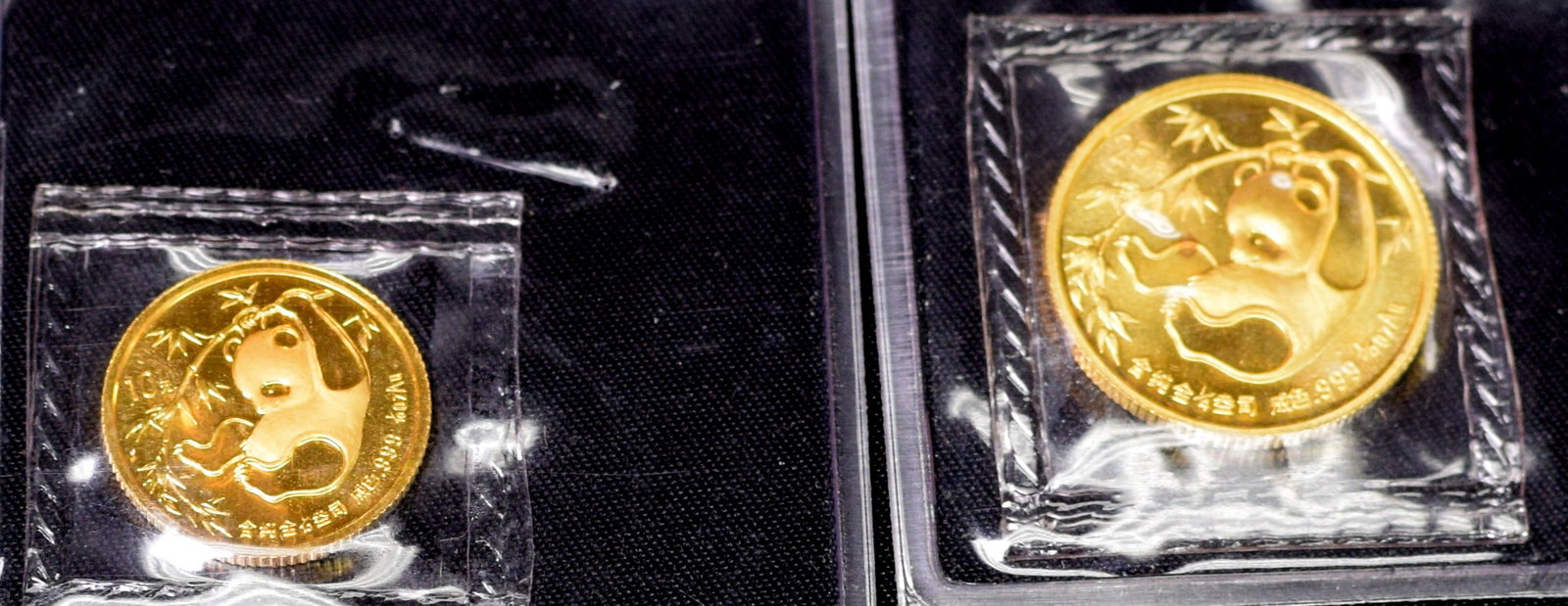 (on-2) CHINESE GOLD PANDA COINS: Consists of 1) 1/4 ounce 1985 gold Chinese Panda coin. Good condition. 2) 1/10 ounce 1985 gold Chinese Panda coin. Good condition. Whites Auctions does not grade coins. Whites will notaccept credit ca
