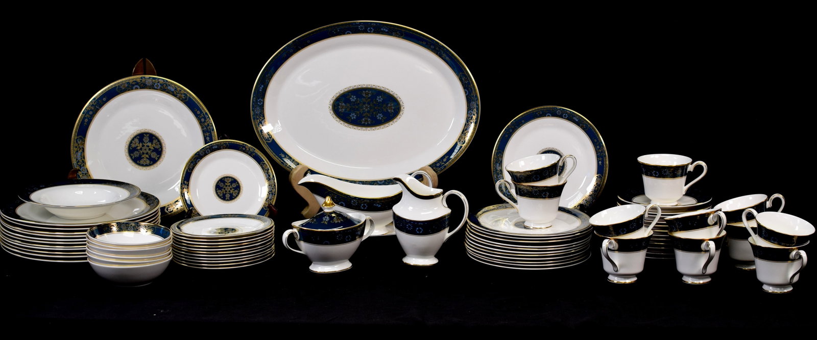 ROYAL DOULTON CHINA CARLILE DINNER SERVICE: 69 pieces. Consists of 1) 12 Dinner plates. 2) 12 salad plates. 3) 12 bread & butter plates. 4) 12 saucers. 5) 11 cups. 6) small bowls.6) Creamer and sugar. 7) Gravy bowl and under tray. 8) Soupbowl. 