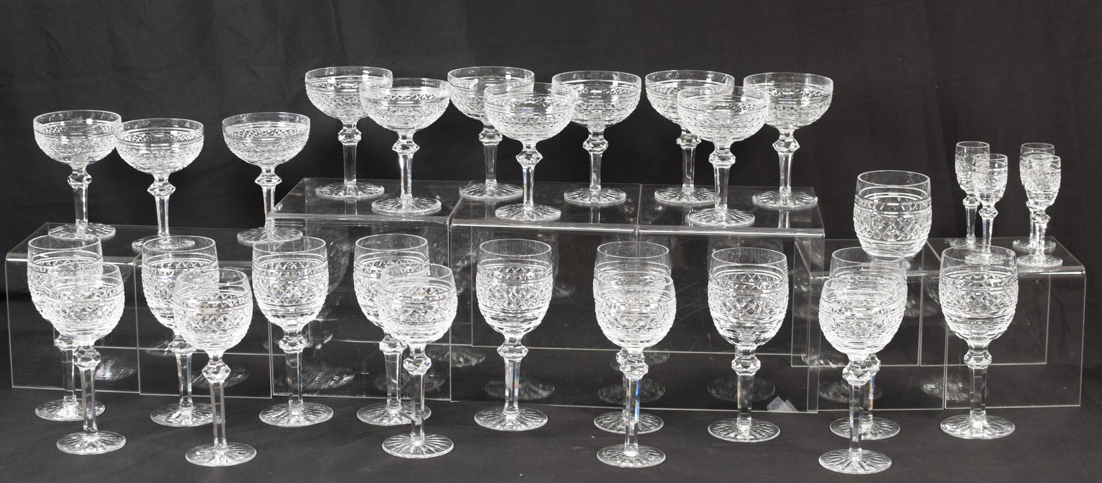 WATERFORD CASTLETOWN CRYSTAL STEMWARE: Consists of 1) 11 Sherberts or champagnes. 5 1/2 inches tall. Good condition. Not signed. 2) 9 water goblets. 7 1/2 inches tall. Signed. Good condition. 3) 5 hock wines. 7 1/4 inches. 4) 4cordials, 4