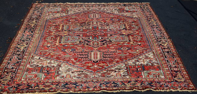 PERSIAN ROOMSIZE HERIZ ORIENTAL RUG: Approx. 8 feet 10 inches x 12 feet. Medallion center. Various colors. Minor moth damage. Turtle border. Shipping 45 pounds.